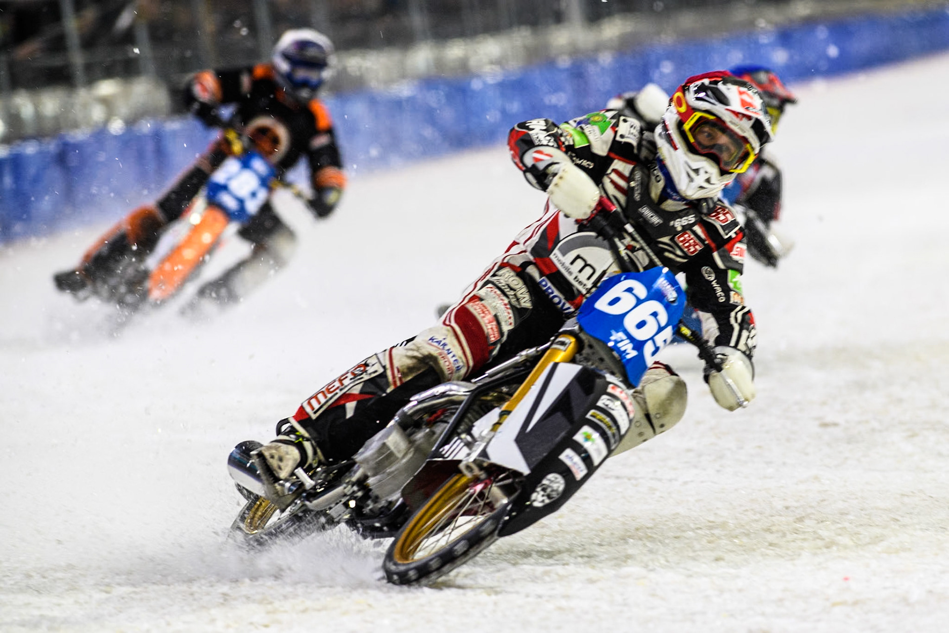 Austria's Charly Ebner (665) in Red leading Czech Republic's Andrej Diviš (107) in Blue and Netherland's Sebastian Reitsma (283) in White during the FIM Ice Speedway Gladiators World Championship Final 4 at Ice Rink Thialf, Heerenveen on Sunday 7th April 2024. (Photo: Ian Charles | MI News)