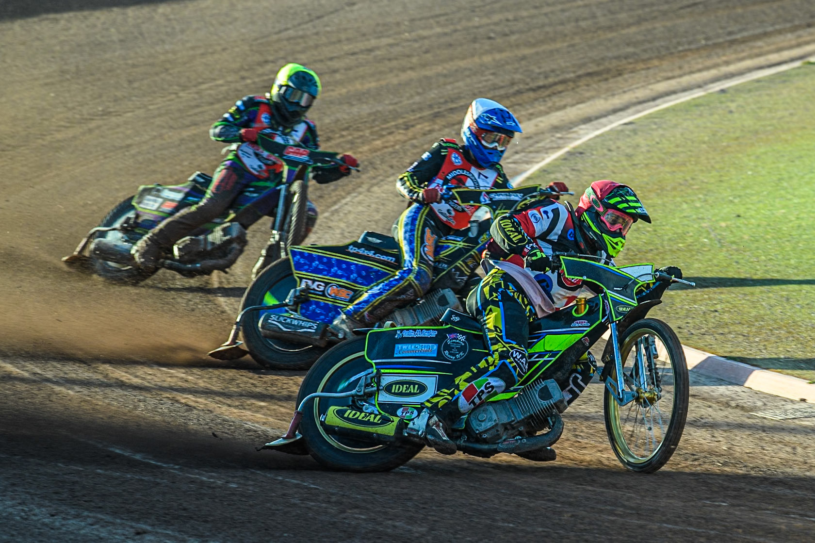 Belle Vue Colts' Guest rider Keiran Douglas in Red leading Middlesbrough Tigers' William Hocaniuk in White and Middlesbrough Tigers' Kai Ward in Yellow during the WSRA National Development League match between Belle Vue Colts and Middlesbrough Tigers at the National Speedway Stadium, Manchester on Monday 17th June 2024. (Photo: Ian Charles | MI News)