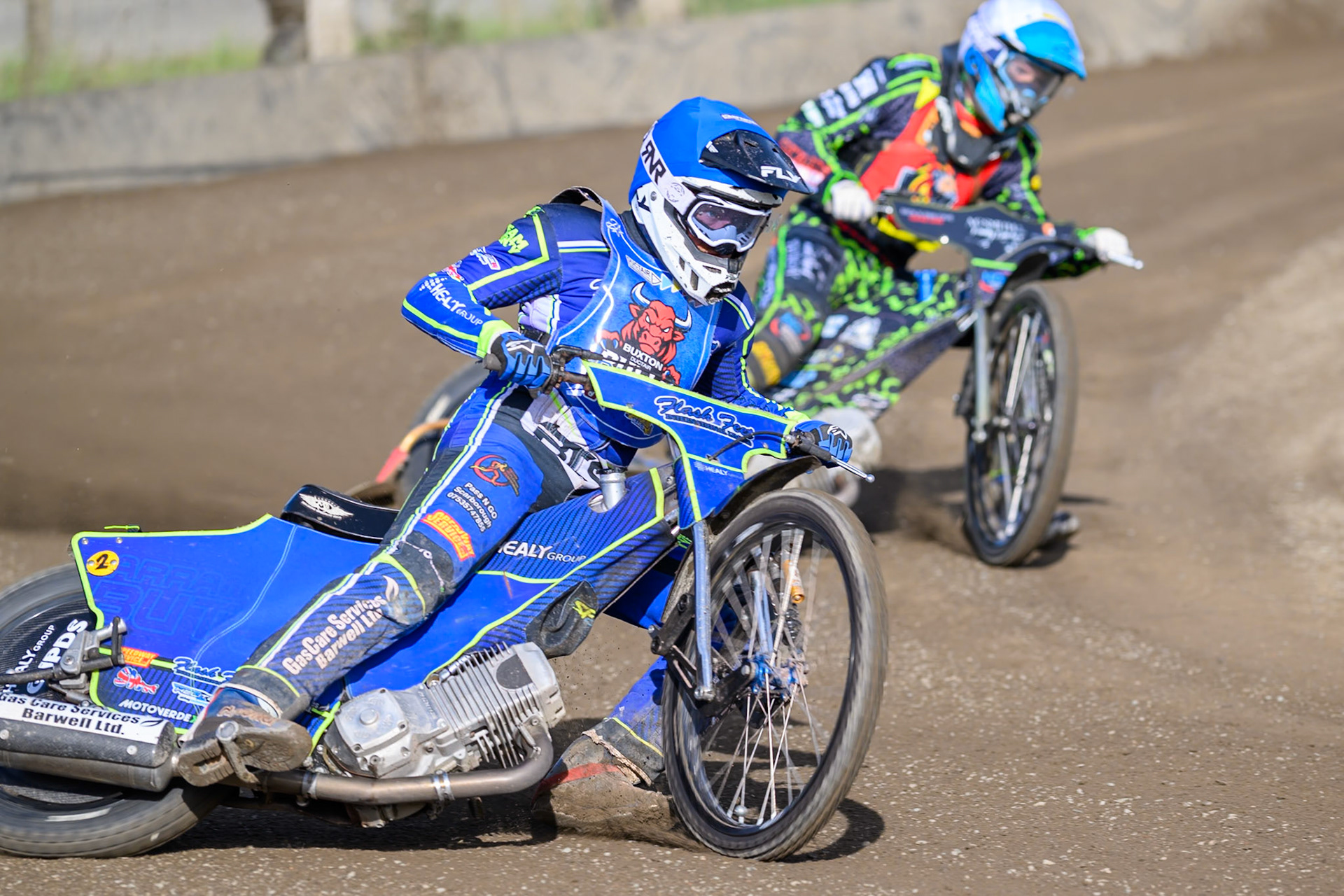 Arran Butcher of Buxton Bulls   in Blue leading Harrison Rogers, Guest rider for Leicester Lion Cubs in White during the WSRA National Development League match between Buxton Bulls and Leicester Lion Cubs at Hi-Edge Speedway, Buxton on Sunday 4th October 2026. (Photo: Ian Charles | MI News)