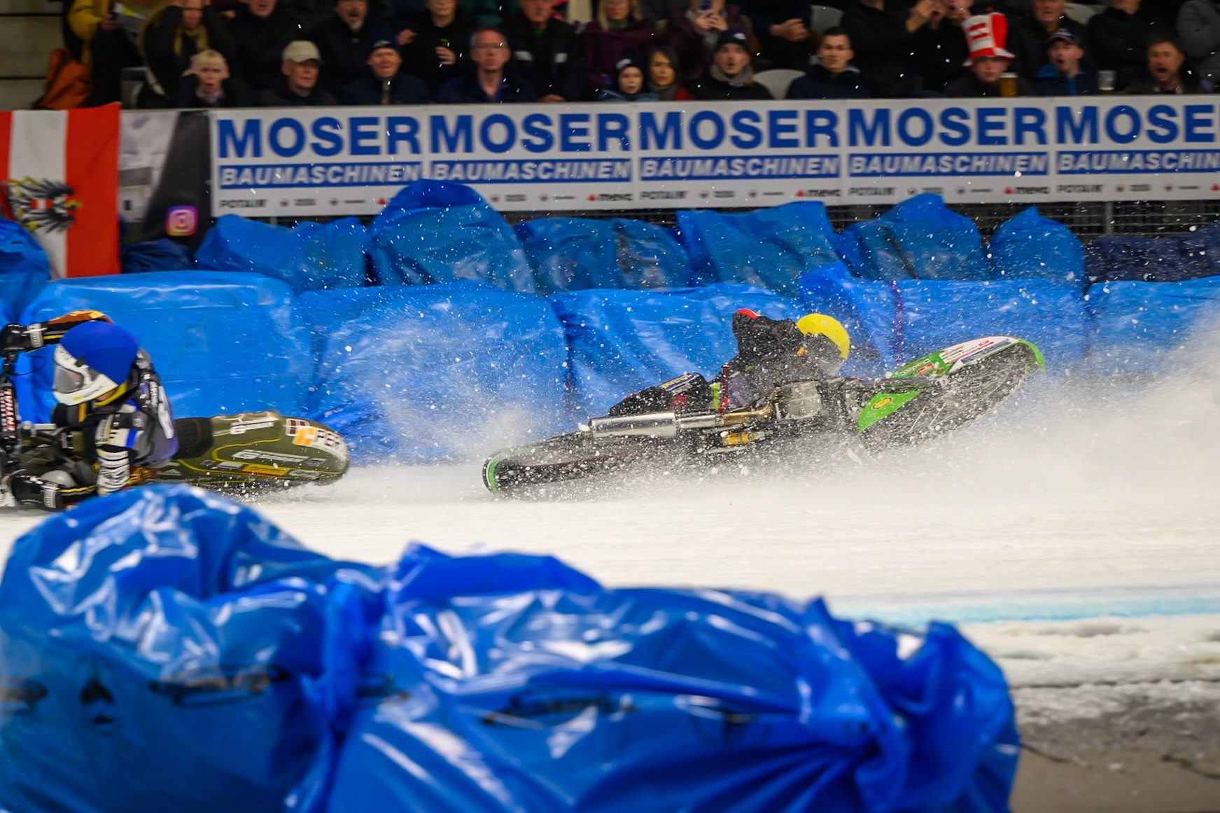 Johann Weber (33) of Germany  spins off behind Heikki Huusko (67) of Finland in Blue during the Ice Speedway Gladiators World Championship Final 1 at Max-Aicher-Arena, Inzell on Saturday 14th March 2026. (Photo: Ian Charles | MI News)