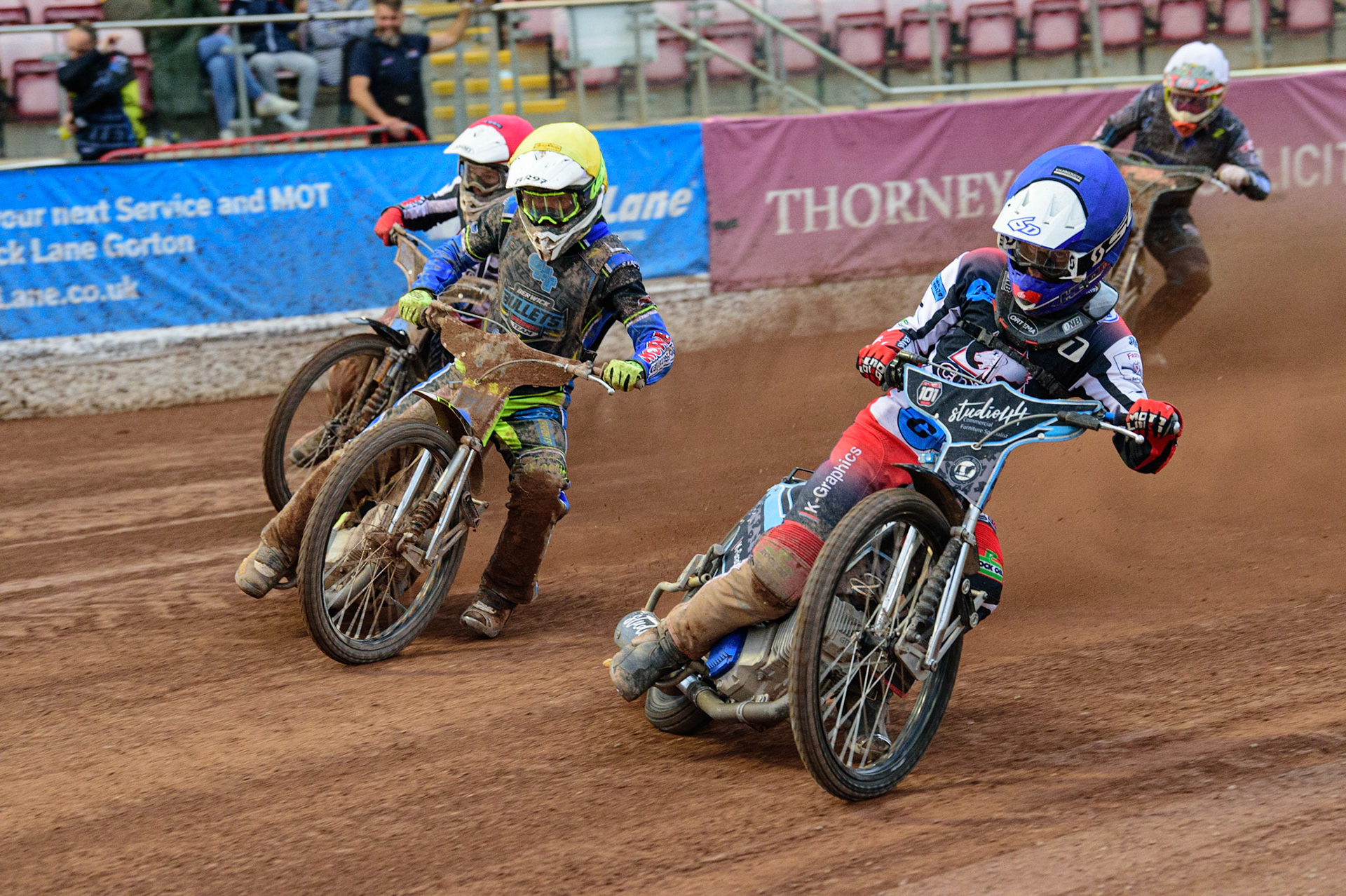 MANCHESTER, UK. JUN 24TH Freddy Hodder  (Blue) leads Ben Rathbone (Yellow) and Sam McGurk  (Red) with Mason Watson  (White) at the rear during the National Development League match between Belle Vue Colts and Berwick Bullets at the National Speedway Stadium, Manchester on Friday 24th June 2022. (Credit: Ian Charles | MI News)