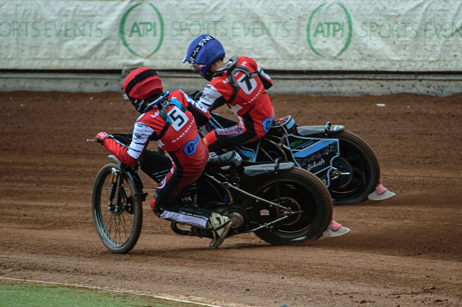 MANCHESTER, UK. APR 15TH  Harry McGurk  (Red) and Freddy Hodder (Blue) on their way to a maximum points heat win for The Colts  during the National Development League match between Belle Vue Colts and Plymouth Centurions at the National Speedway Stadium, Manchester on Friday 15th April 2022. (Credit: Ian Charles | MI News)