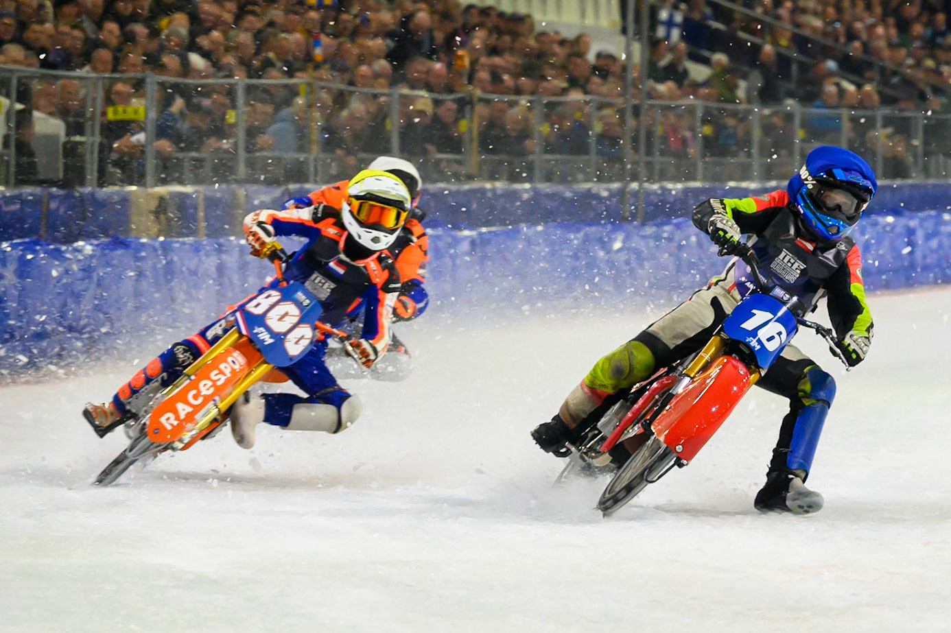 Wild Card Harald Simon (16) of Austria  in Blue rides inside Jasper Iwema (800) of The Netherlands in Yellow during the FIM Ice Speedway Gladiators World Championship Final 3 at Ice Rink Thialf, Heerenveen on Saturday 11th April 2026. (Photo: Ian Charles | MI News)