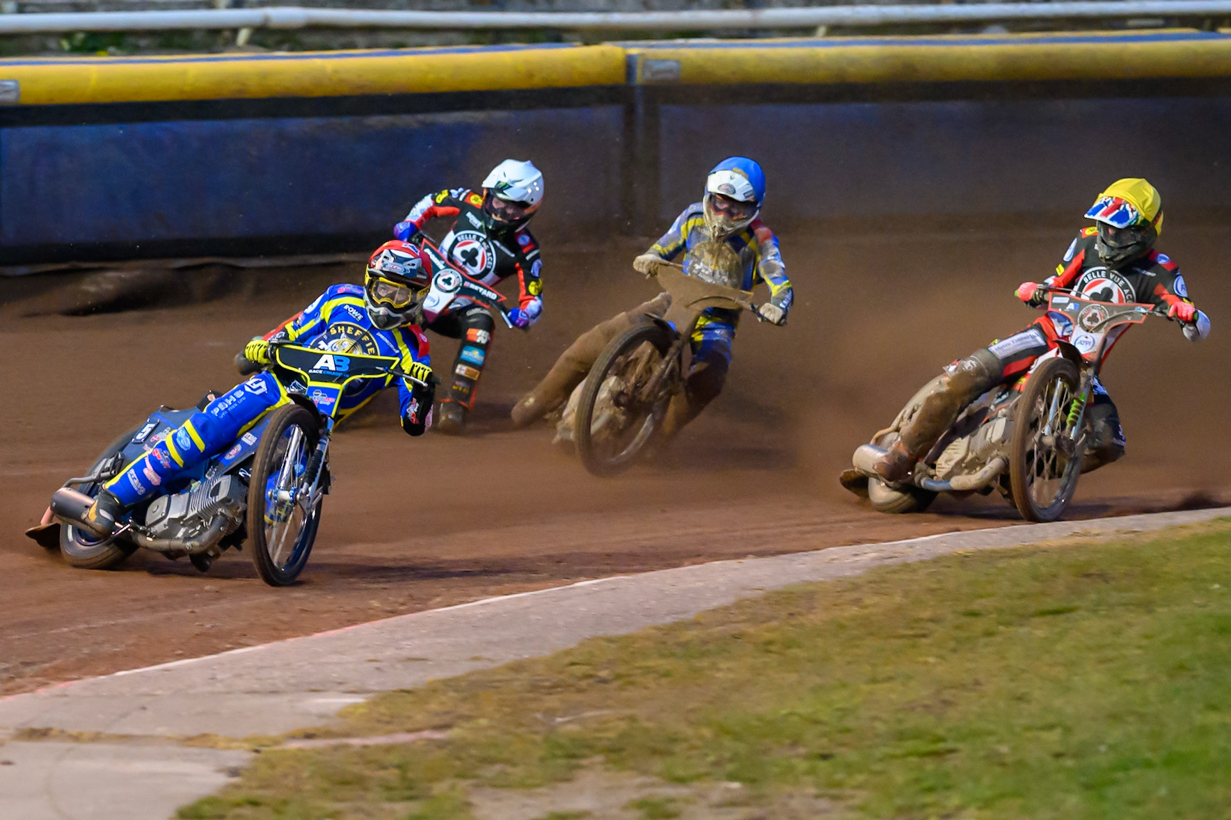 Josh Pickering of Sheffield Tigers  in Red leading Dan Bewley of Belle Vue Aces in White, Luke Killeen of Sheffield Tigers  \in Blue, and William Cairns of Belle Vue Aces in Yellow during the Knockout Cup Northern Section match between Sheffield Tigers and Belle Vue Aces at Owlerton Stadium, Sheffield on Thursday 2nd April 2026. (Photo: Ian Charles | MI News)