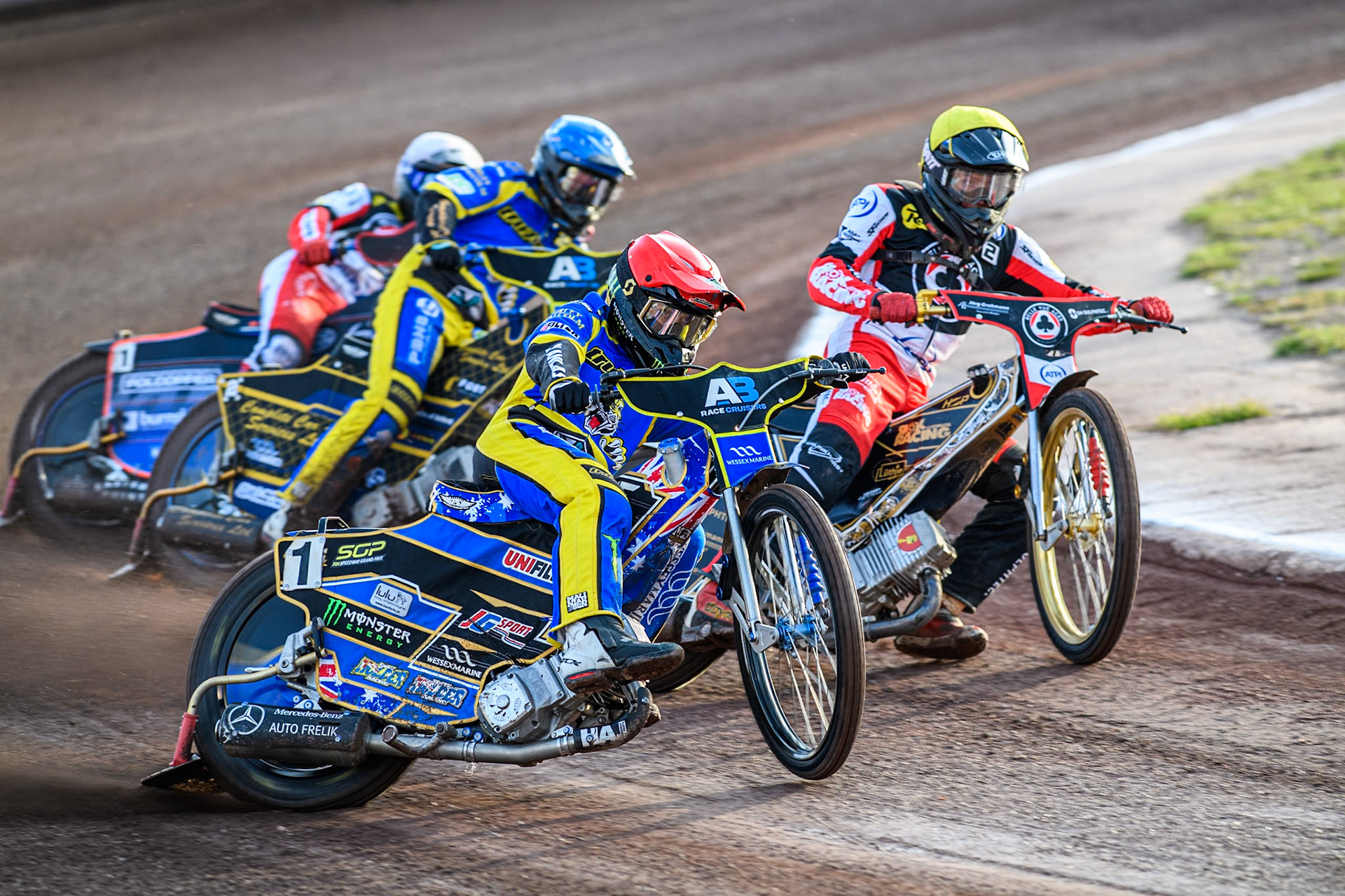 Sheffield Tigers' Jack Holder in Red rides outside Belle Vue Aces' Norick Blodorn  in Yellow with Sheffield Tigers' Kyle Howarth  in Blue and Belle Vue Aces' Brady Kurtz  in White behind during the Premiership KO Cup Quarter Final, 2nd Leg match between Sheffield Tigers and Belle Vue Aces at Owlerton Stadium, Sheffield on Thursday 9th May 2024. (Photo: Ian Charles | MI News)