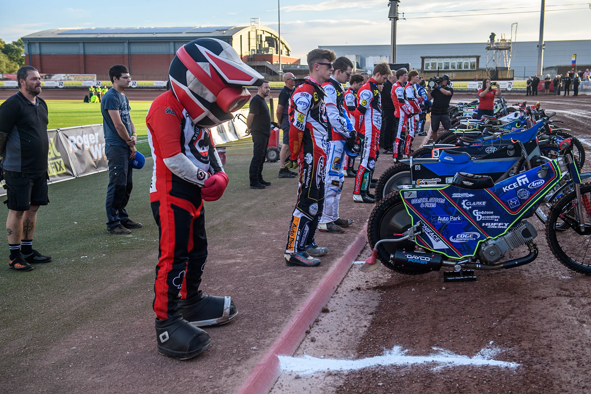 The Belle Vue riders observe a one minutes silence following the death of Referee Tony Steele during the Rowe Motor Oil Premiership match between Belle Vue Aces and King's Lynn Stars at the National Speedway Stadium, Manchester on Monday 12th August 2024. (Photo: Ian Charles | MI News)