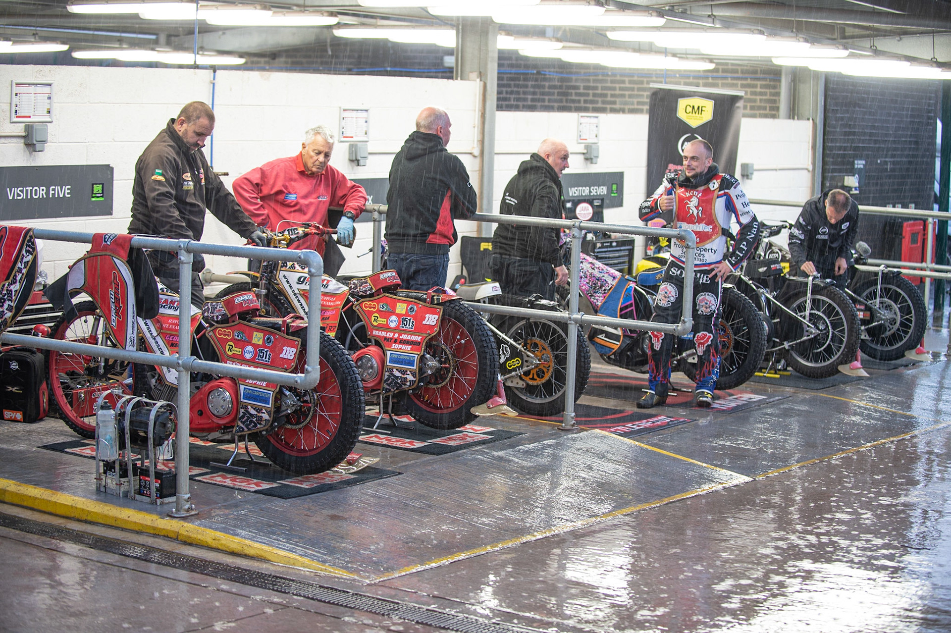 Photo: Ian Charles

Riders shelter from the rain after a downpour before the meeting

Belle Vue Colts v Kent Kings, SGB National League, Belle Vue National Speedway Stadium, Manchester, Thursday 1  August  2019