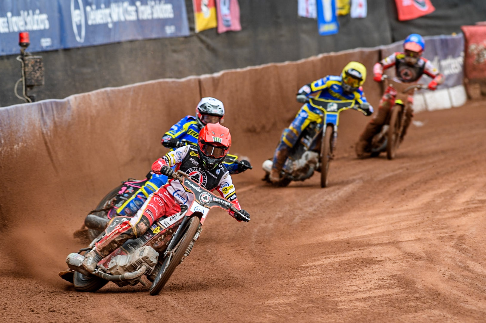 Brady Kurtz of Belle Vue Aces in Red leading Chris Holder of Sheffield Tigers in White, Norick Blödorn of Belle Vue Aces in Blue’ and Lewis Kerr of Sheffield Tigers in Yellow during the Rowe Motor Oil Premiership match between Belle Vue Aces and Sheffield Tigers at the National Speedway Stadium, Manchester on Monday 5th May 2025. (Photo: Ian Charles | MI News)