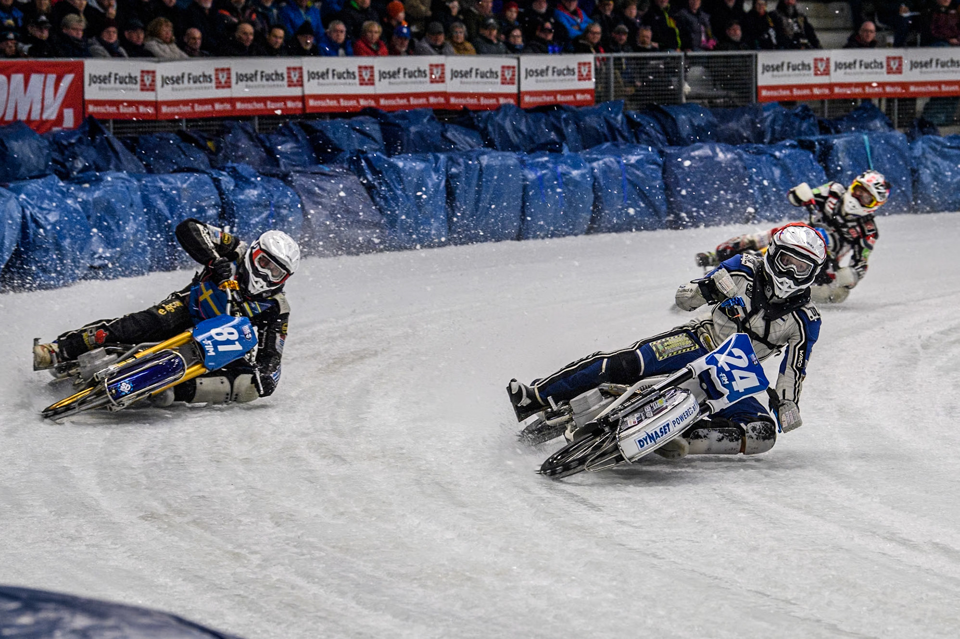 Finland's Max Koivula (24)  (Red) inside Sweden"s Jimmy Olsén (81) (White) during the FIM Ice Speedway Gladiators World Championship Final 2 at the Max-Aicher-Arena, Inzell on Sunday 24 March 2024. (Photo: Ian Charles | MI News)