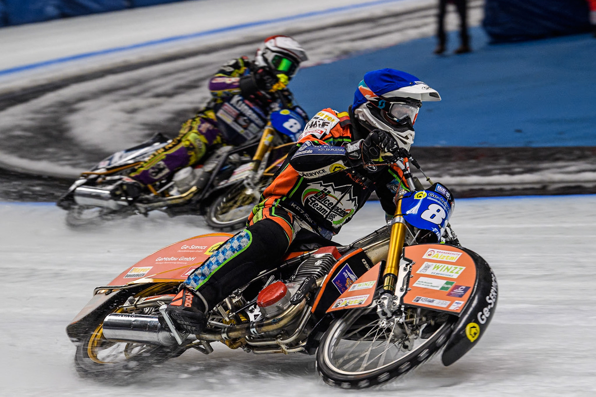 Germany's Markus Jell (82) (Blue) outside Germany's Max Niedermaier (88) (Red) during the FIM Ice Speedway Gladiators World Championship Final 1 at the Max-Aicher-Arena, Inzell on Saturday 23 March 2024. (Photo: Ian Charles | MI News)