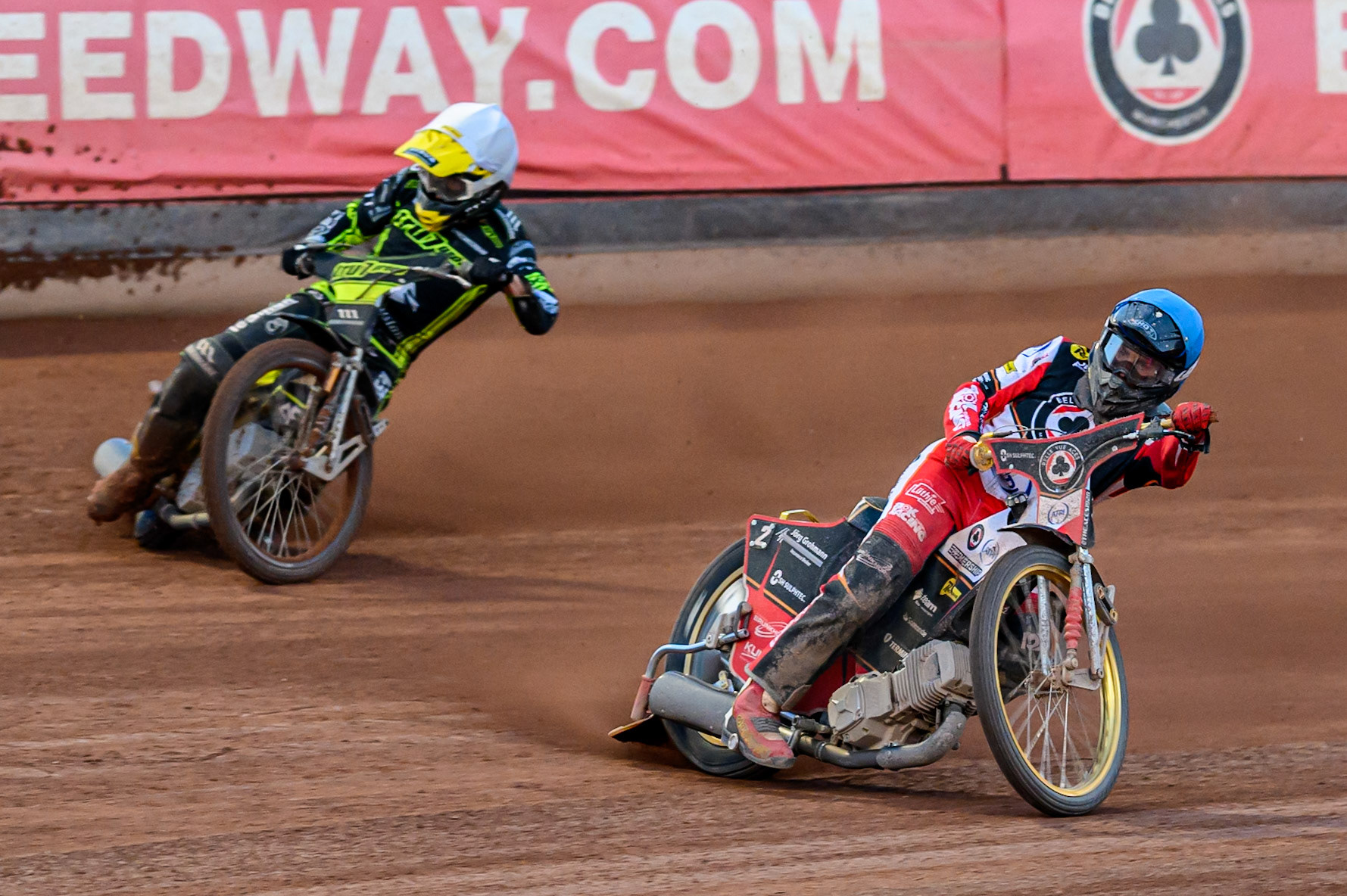 Norick Blödorn of Belle Vue Aces in Blue leading Adam Ellis of Ipswich Witches  in White during the Rowe Motor Oil Premiership match between Belle Vue Aces and Ipswich Witches at the National Speedway Stadium, Manchester on Monday 4th August 2025. (Photo: Ian Charles | MI News)