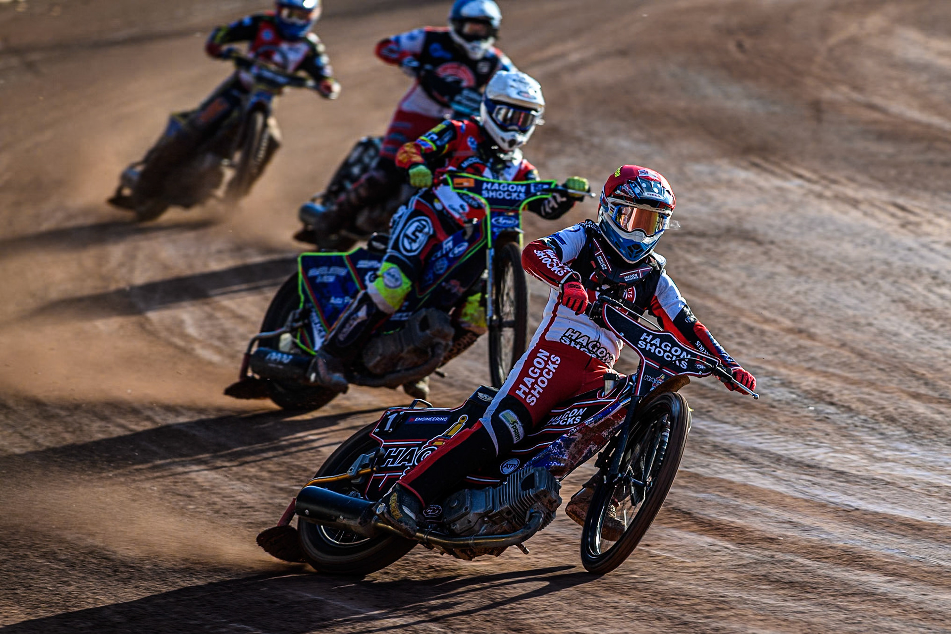 Belle Vue Colts' Sam Hagon in Red leading Middlesbrough Tigers' Jake Mulford in White, Belle Vue Colts' Chad Wirtzfeld in Blue and Middlesbrough Tigers' William Hocaniuk in Yellow during the WSRA National Development League match between Belle Vue Colts and Middlesbrough Tigers at the National Sp eedway Stadium, Manchester on Monday 17th June 2024. (Photo: Ian Charles | MI News)