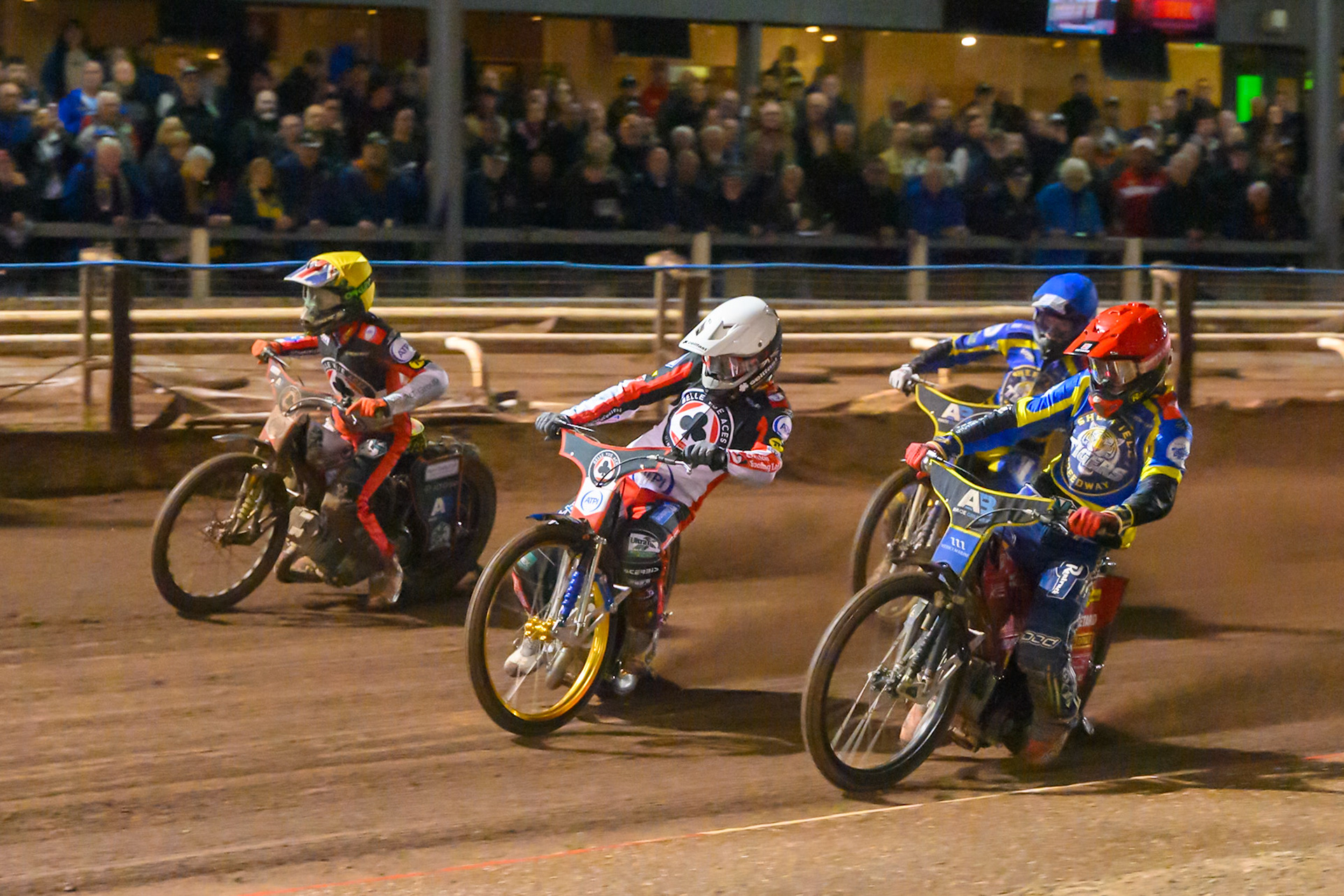 Jason Doyle of Belle Vue Aces in White rides outside Max Fricke, Guest Rider for Sheffield Tigers in Red , Will Cairns of Belle Vue Aces in Yellow  and Anders Rowe of Sheffield Tigers in Blue during the Rowe Motor Oil Premiership Grand Final 1st Leg match between Sheffield Tigers and Belle Vue Aces at Owlerton Stadium, Sheffield on Monday 12th October 2026. (Photo: Ian Charles | MI News)