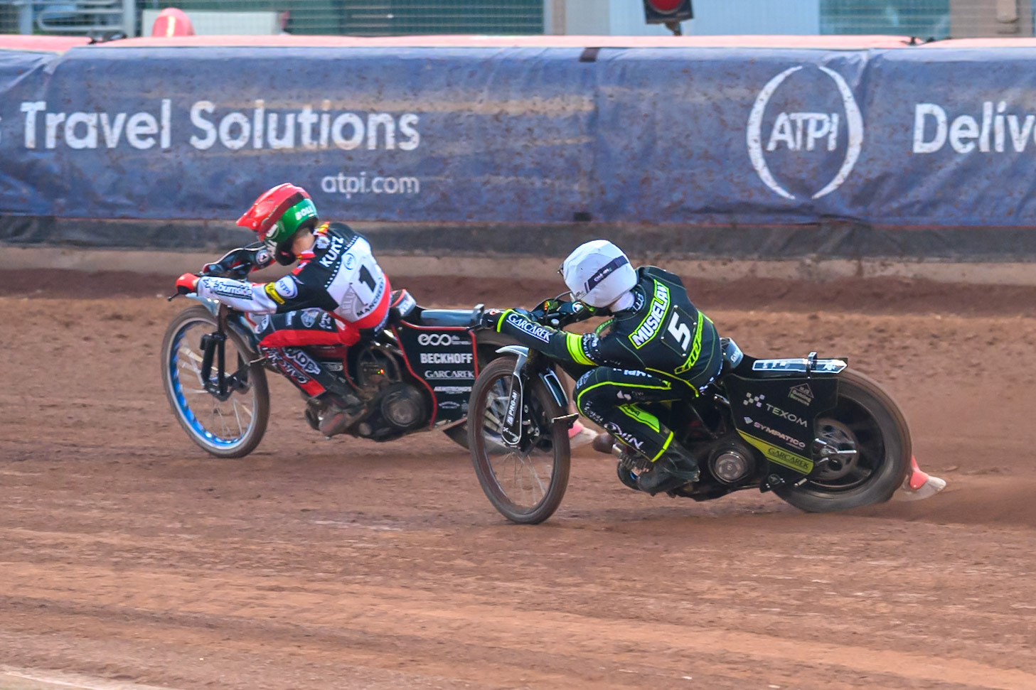 Tobiasz Musielak of Ipswich Witches  in White chases Brady Kurtz of Belle Vue Aces  in Red during the Rowe Motor Oil Premiership match between Belle Vue Aces and Ipswich Witches at the National Speedway Stadium, Manchester on Monday 20th April 2026. (Photo: Ian Charles | MI News)