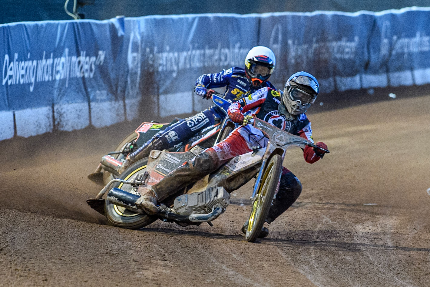Norick Blödorn of Belle Vue Aces in Blue leading Jan Kvech of Kings Lynn Stars in White during the Rowe Motor Oil Premiership match between Belle Vue Aces and King's Lynn Stars at the National Speedway Stadium, Manchester on Monday 5th April 2025. (Photo: Ian Charles | MI News)