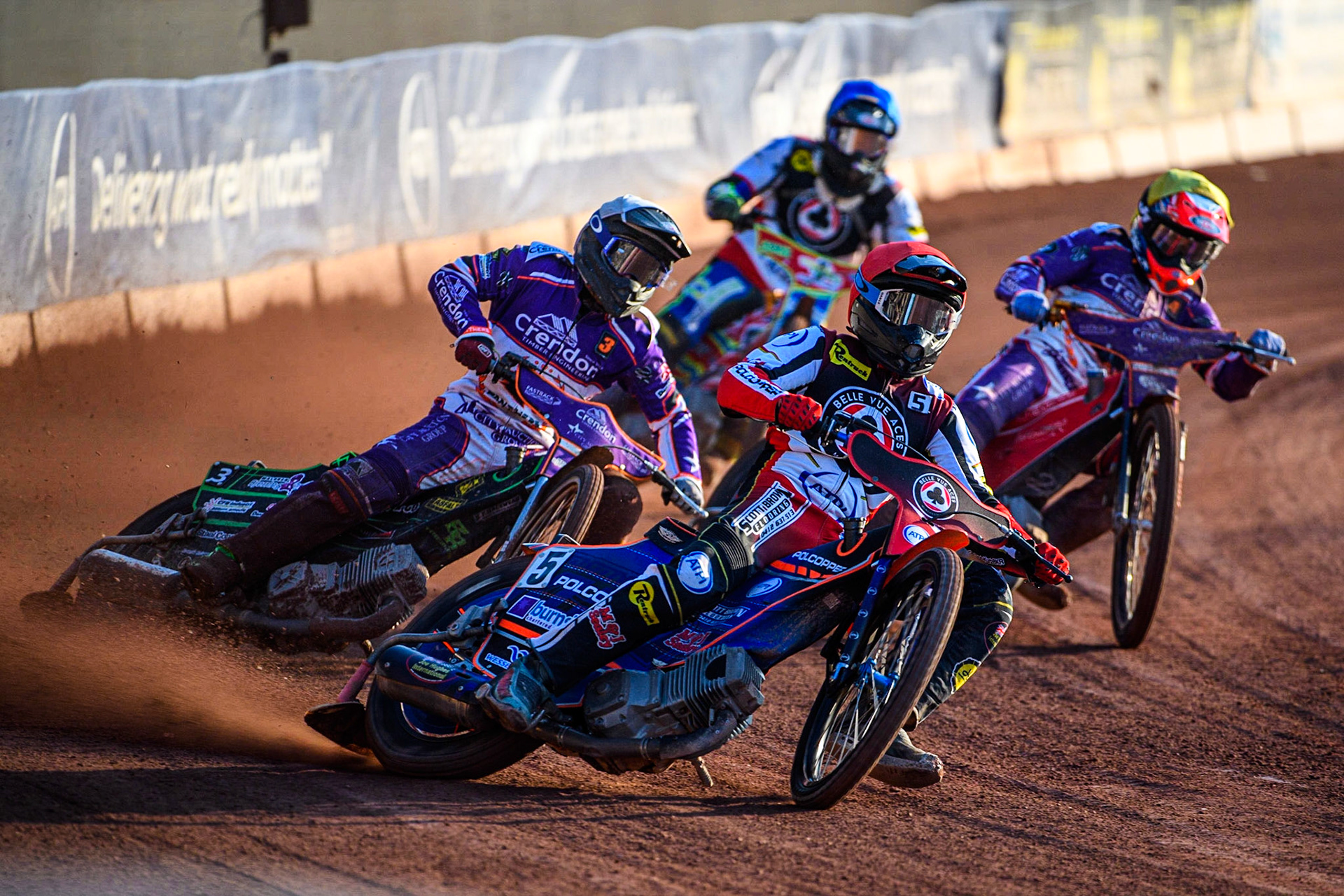 Brady Kurtz (Red) leads Benjamin Basso (White) Richie Worrall (Yellow) and Simon Lambert (Blue) during the Sports Insure Premiership match between Belle Vue Aces and Peterborough at the National Speedway Stadium, Manchester on Monday 19th June 2023. (Photo: Ian Charles | MI News)
