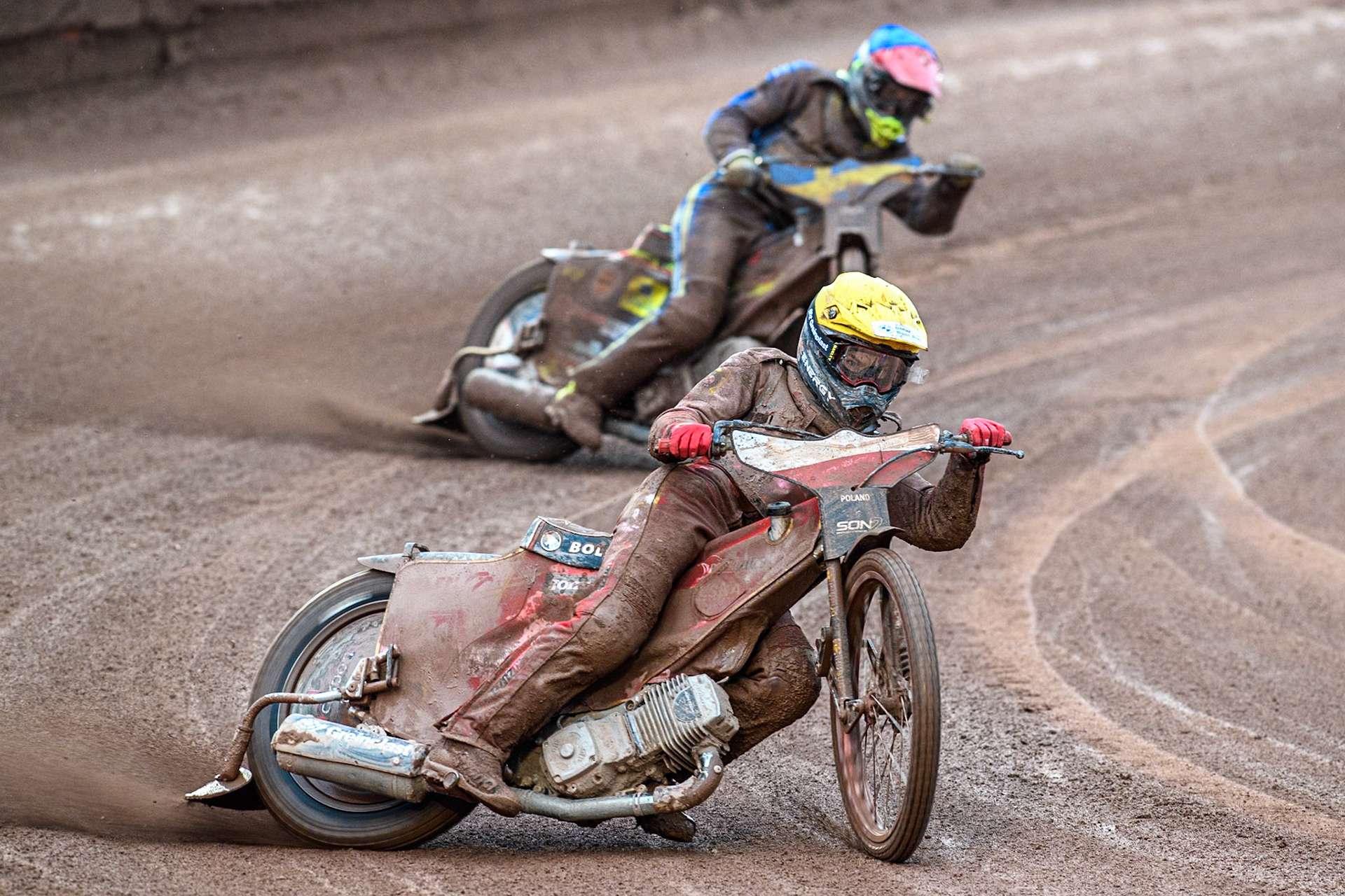 Bartosz Banbor of Poland in Yellow leading Casper Henriksson of Sweden in Blue during the Monster Energy FIM Speedway of Nations 2 (Under 21) Final at the National Speedway Stadium, Manchester on Friday 12th July 2024. (Photo: Ian Charles | MI News)