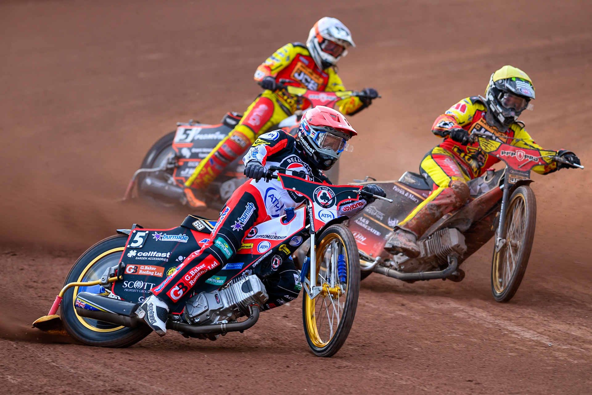 Jason Doyle of Belle Vue Aces in Red rides outside Joe Thompson of Leicester Lions in Yellow with Sam Masters of Leicester Lions in White behind during the Rowe Motor Oil Premiership match between Belle Vue Aces and Leicester Lions at the National Speedway Stadium, Manchester on Monday 3rd August 2026. (Photo: Ian Charles | MI News)