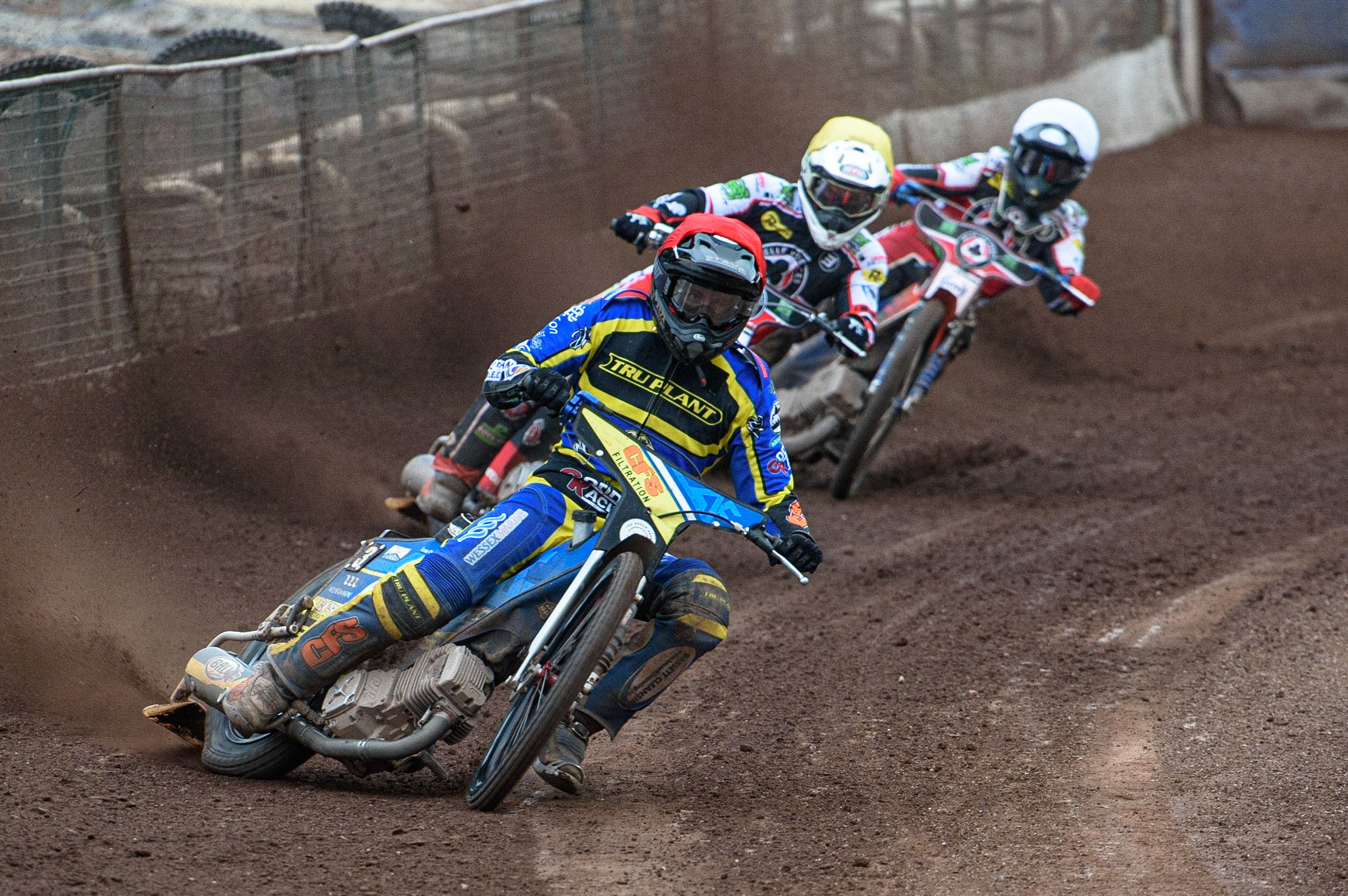 SHEFFIELD, UK. JULY 1ST     Adam Ellis  (Red) leads Richie Worrall  (Yellow) and Brady Kurtz  (White) during the SGB Premiership match between Sheffield Tigers and Belle Vue Aces at Owlerton Stadium, Sheffield on Thursday 1st July 2021. (Credit: Ian Charles | MI News)