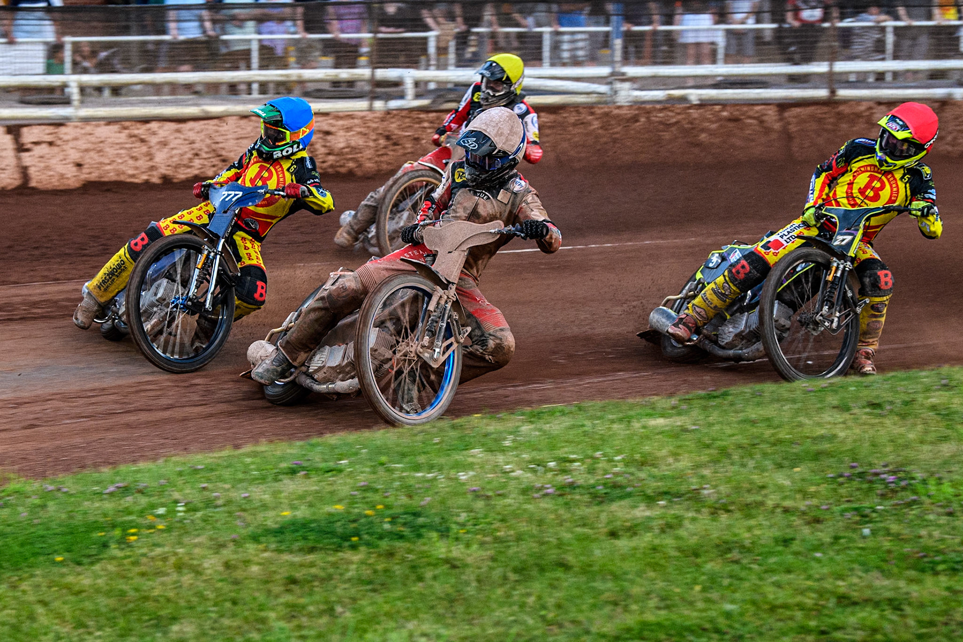 Belle Vue Aces' Brady Kurtz in White rides inside Birmingham Brummies' Piotr Pawlicki in Blue with Birmingham Brummies' Tom Brennan in Red and Belle Vue Aces' Norick Blodorn in Yellow behind during the Rowe Motor Oil Premiership match between Birmingham Brummies and Belle Vue Aces at Perry Bar Stadium, Birmingham on Monday 29th July 2024. (Photo: Ian Charles | MI News)