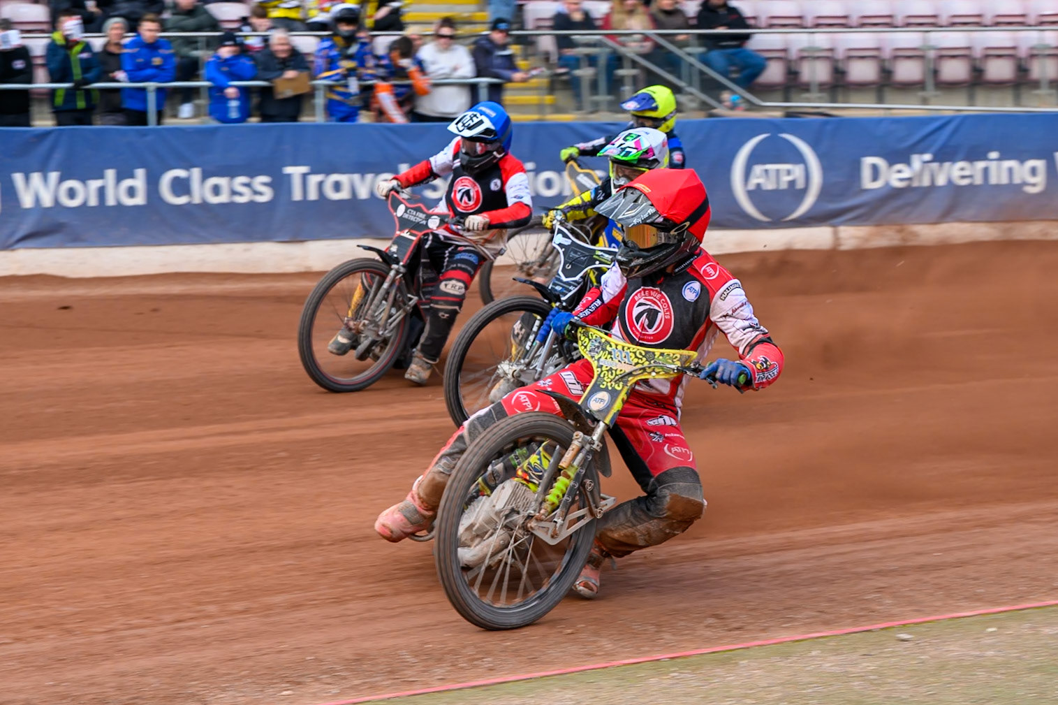 Belle Vue Colts' William Cairns in Red leading Monarchs' Dayle Wood in White, Belle Vue Colts' Guest Rider Ben Morley in Blue and Monarchs' Guest Rider Vinnie Foord in Yellow during the WSRA National Development League match between Belle Vue Aces and Edinburgh Academy at the National Speedway Stadium, Manchester on Sunday 12th October 2025. (Photo: Ian Charles | MI News)