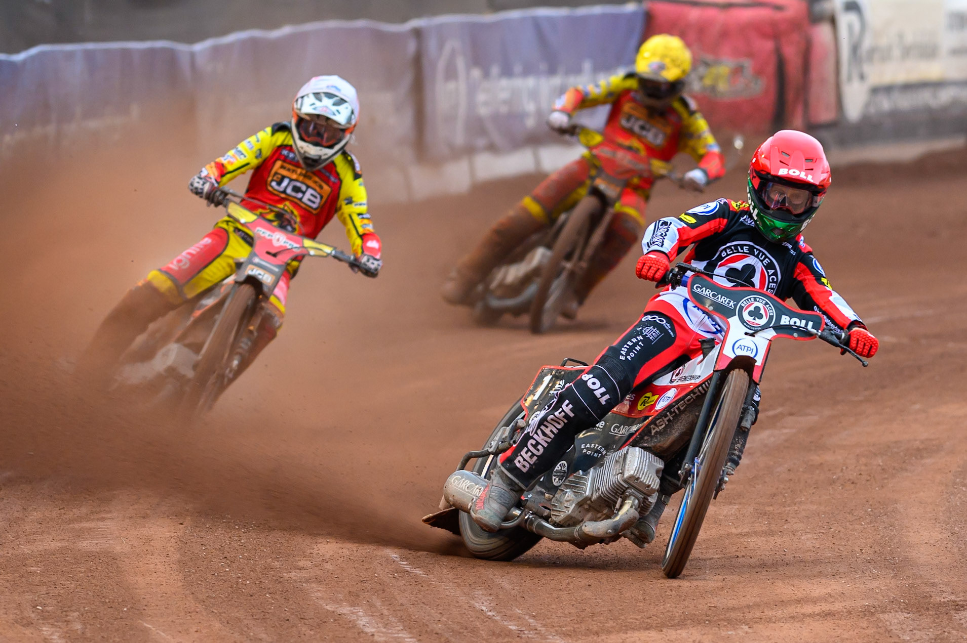 Brady Kurtz of Belle Vue Aces in Red leading Sam Masters of Leicester Lions in White and Kyle Howarth of Leicester Lions in Yellow during the Rowe Motor Oil Premiership match between Belle Vue Aces and Leicester Lions at the National Speedway Stadium, Manchester on Monday 15th June 2026. (Photo: Ian Charles | MI News)