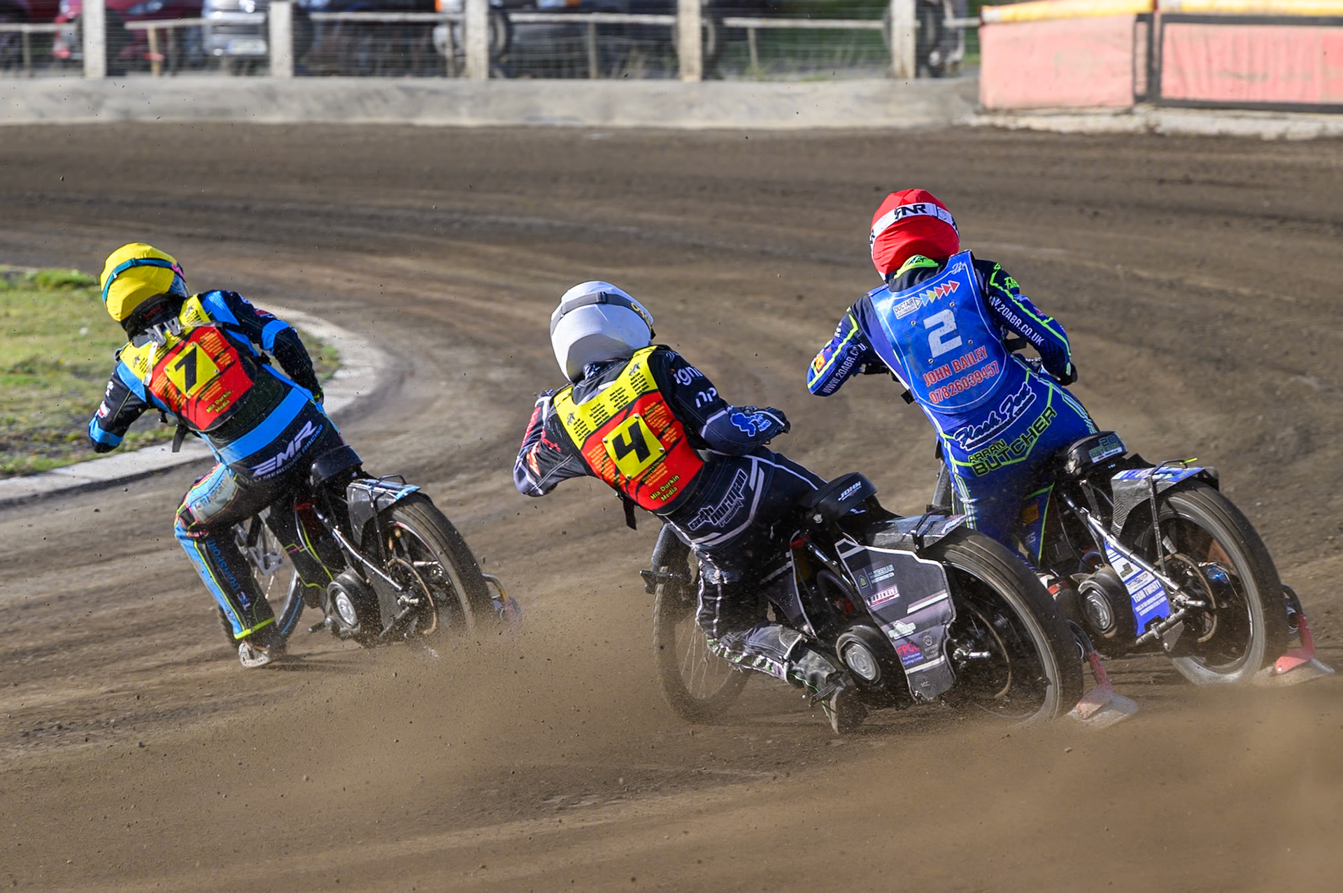 Seth Norman of Leicester Lion Cubs   in White chases Arran Butcher of Buxton Bulls   in Red  and Eli Meadows  of Leicester Lion Cubs  in Yellow during the WSRA National Development League match between Buxton Bulls and Leicester Lion Cubs at Hi-Edge Speedway, Buxton on Sunday 4th October 2026. (Photo: Ian Charles | MI News)