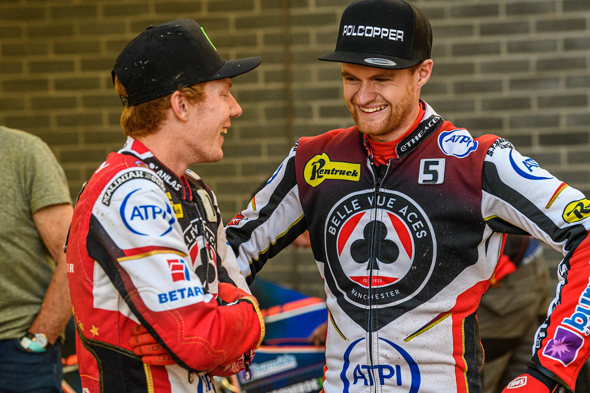 Dan Bewley (left) shares a joke with team mate Brady Kurtz during the Sports Insure Premiership match between Belle Vue Aces and Ipswich Witches at the National Speedway Stadium, Manchester on Monday 5th June 2023. (Photo: Ian Charles | MI News)