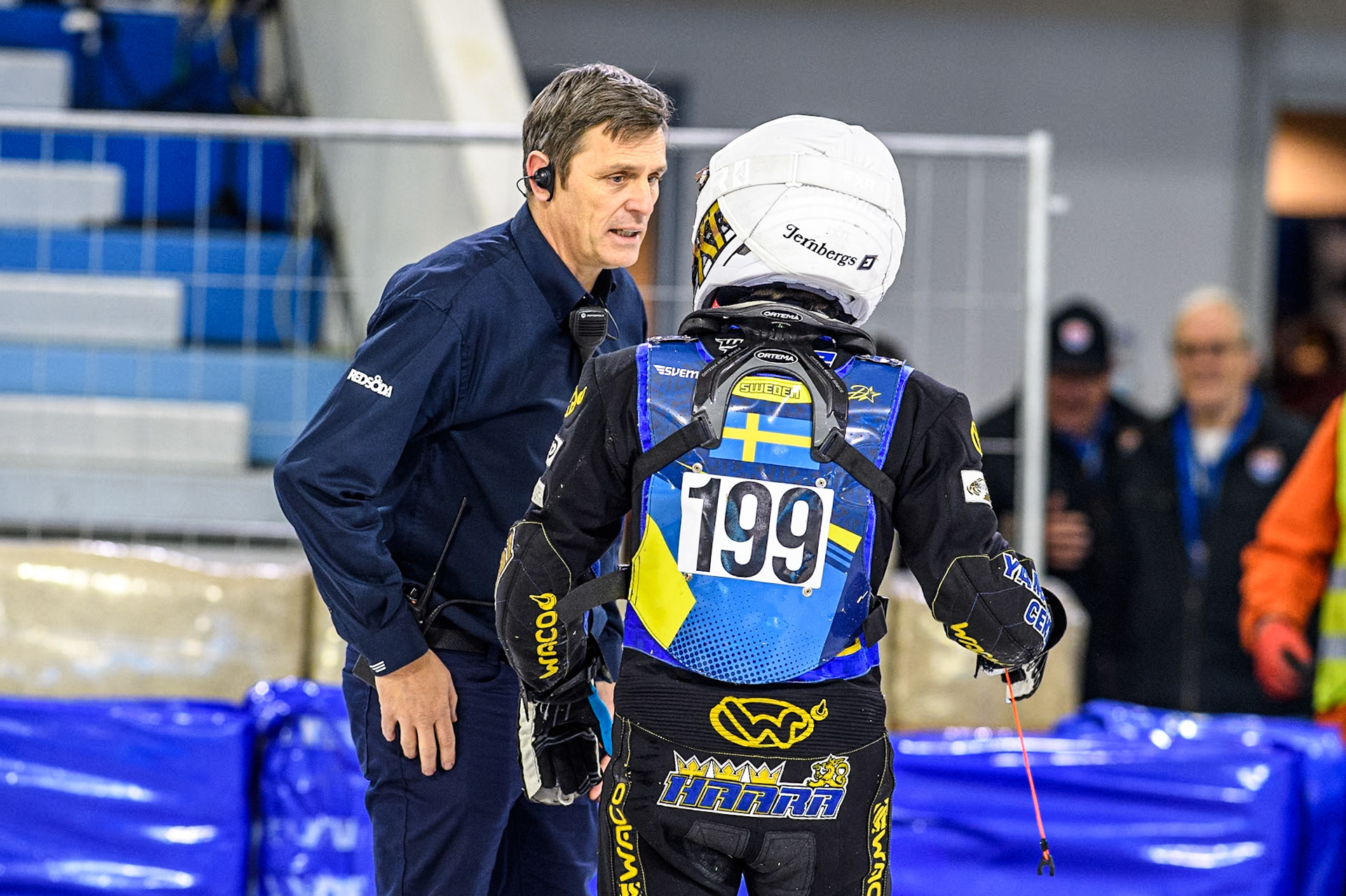 Sweden's Martin Haarahiltunen (199)  talks to race director Phil Morris (Left) after his disqualification during the FIM Ice Speedway Gladiators World Championship Final 4 at Ice Rink Thialf, Heerenveen on Sunday 7th April 2024. (Photo: Ian Charles | MI News)
