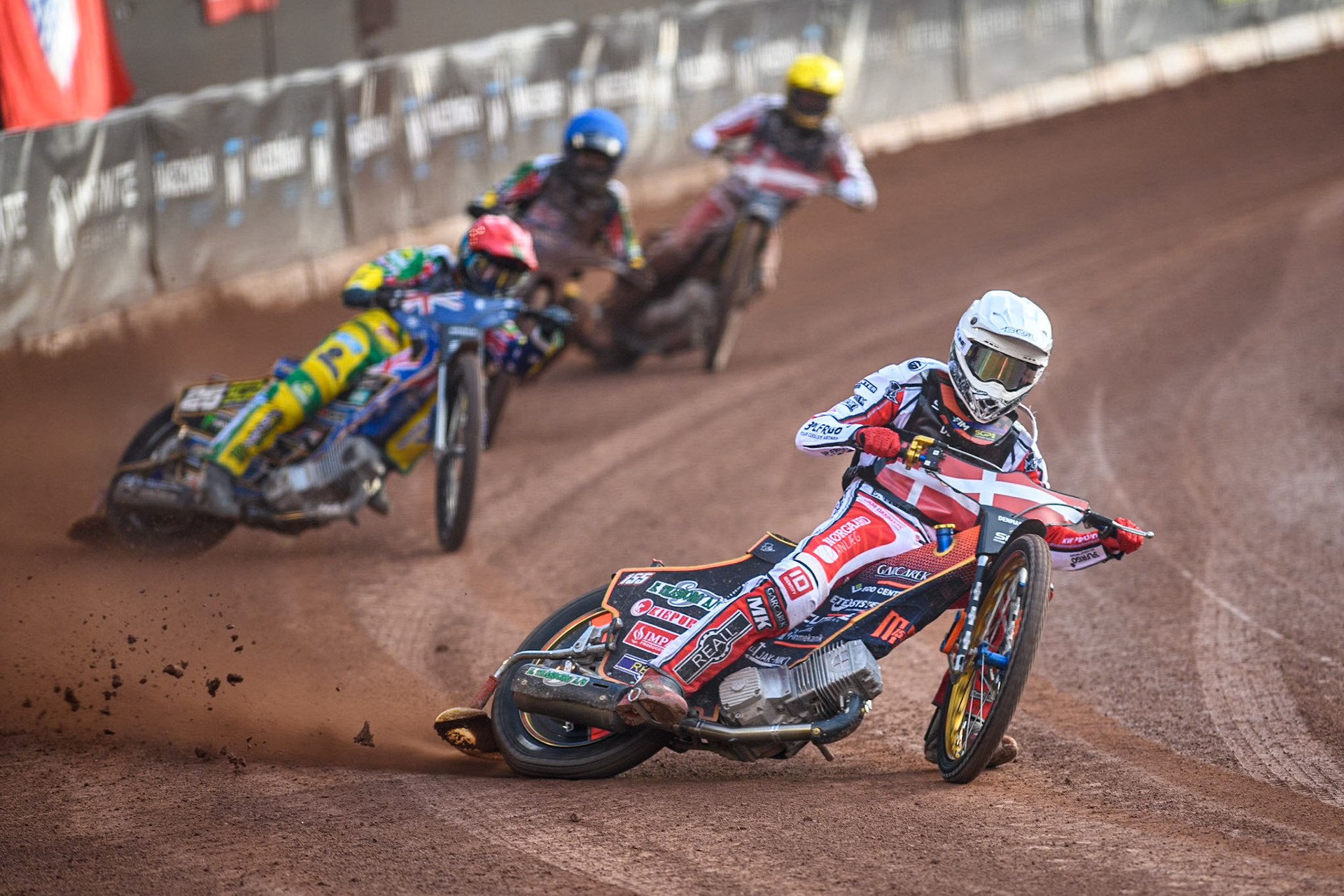 DENMARK v AUSTRALIA: Mikkel Michelsen of Denmark in White leading Jack Holder of Australia in Red, Brady Kurtz of Australia in Blue and Anders Thomsen of Denmark in Yellow during the Monster Energy FIM Speedway of Nation Final at the National Speedway Stadium, Manchester on Saturday 13th July 2024. (Photo: Ian Charles | MI News)