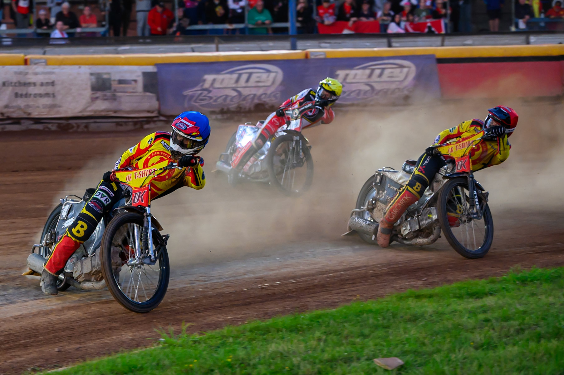 Birmingham Brummies' Keynan Rew  in Blue leading Birmingham Brummies' Tobias Musielak  in Red and Belle Vue Aces' Dan Bewley  in Yellow during the Rowe Motor Oil Premiership match between Birmingham Brummies and Belle Vue Aces at Perry Barr Stadium, Birmingham on Monday 28th July 2025. (Photo: Ian Charles | MI News)