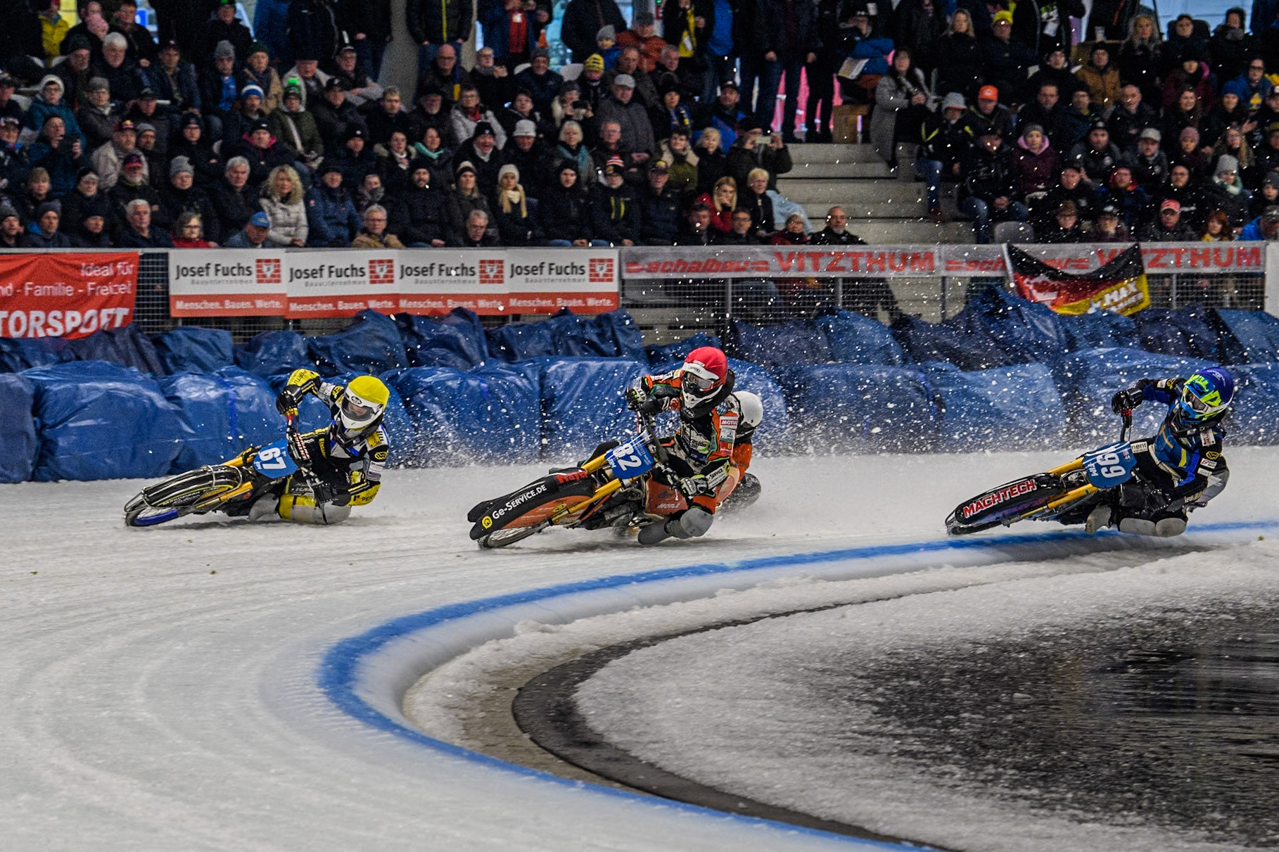 The Re-Run of heat12: \97\ (Yellow) outside Germany's Markus Jell (82) (Red) and Sweden's Martin Haarahiltunen (199)  (Blue) with Finland's Aki Ala-Riihimäki (66) (White) behind  during the FIM Ice Speedway Gladiators World Championship Final 2 at the Max-Aicher-Arena, Inzell on Sunday 24 March 2024. (Photo: Ian Charles | MI News)