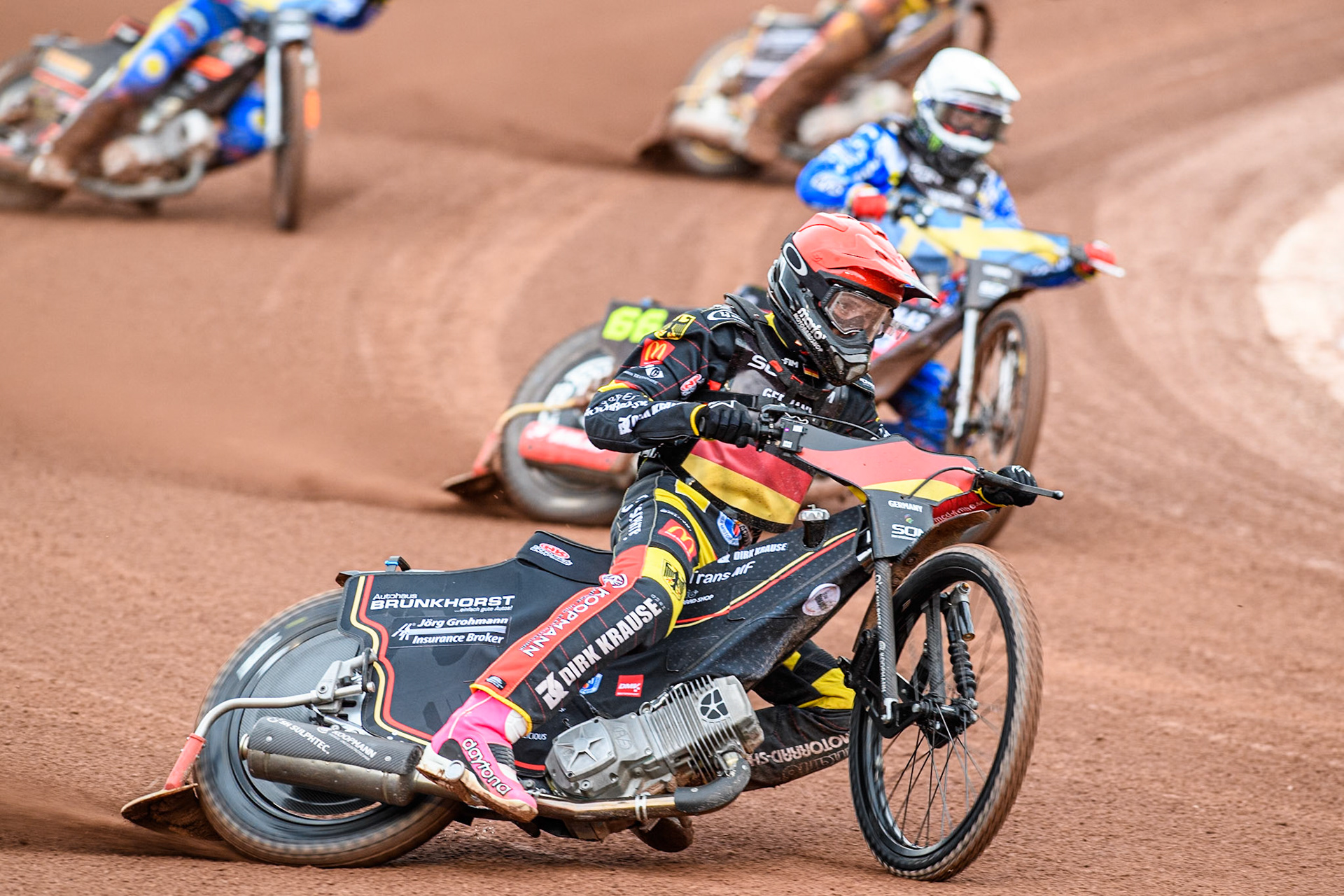 Kai Huckenbeck of Germany in Red leading Fredrik Lindgren of Sweden in White during the Monster Energy FIM Speedway of Nations Semi-Final 1 at the National Speedway Stadium, Manchester on Tuesday 9th July 2024. (Photo: Ian Charles | MI News)
