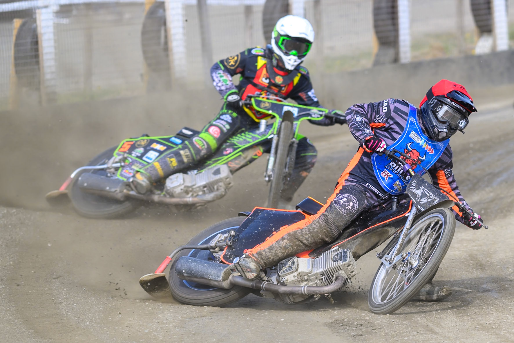 Jack Roberts of Buxton Bulls in Red leading Max Perry of Leicester Lion Cubs  in White during the Challenge match between Buxton Bulls and Leicester Lion Cubs at Hi-Edge Speedway, Buxton on Sunday 26th April 2026. (Photo: Ian Charles | MI News)