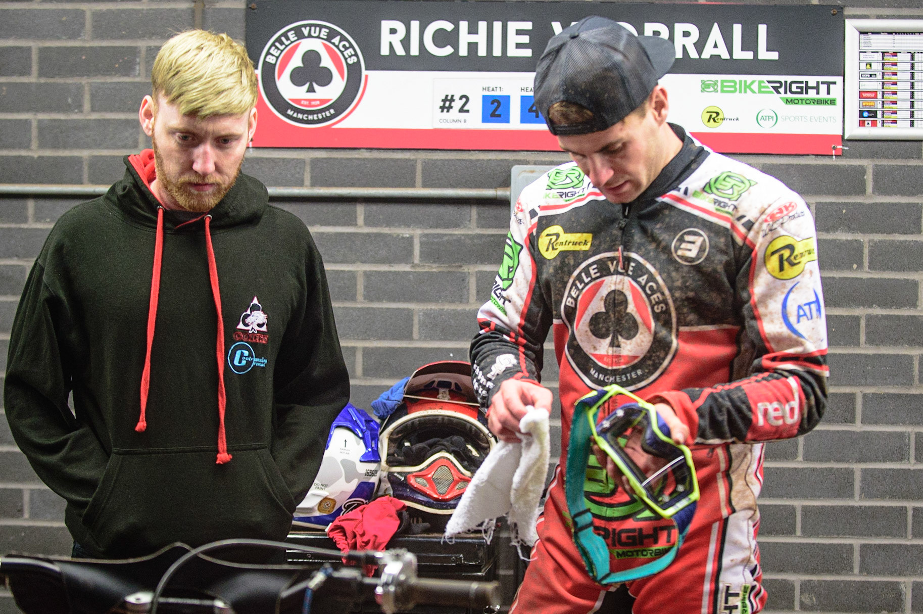 MANCHESTER, UK. OCT 11TH  Richie Worrall (right) cleans his helmet as he chats with Belle Vue Colts rider Paul Bowen during the SGB Premiership Grand Final 1st Leg between Belle Vue Aces and Peterborough Panthers at the National Speedway Stadium, Manchester on Monday 11th October 2021. (Credit: Ian Charles | MI News)