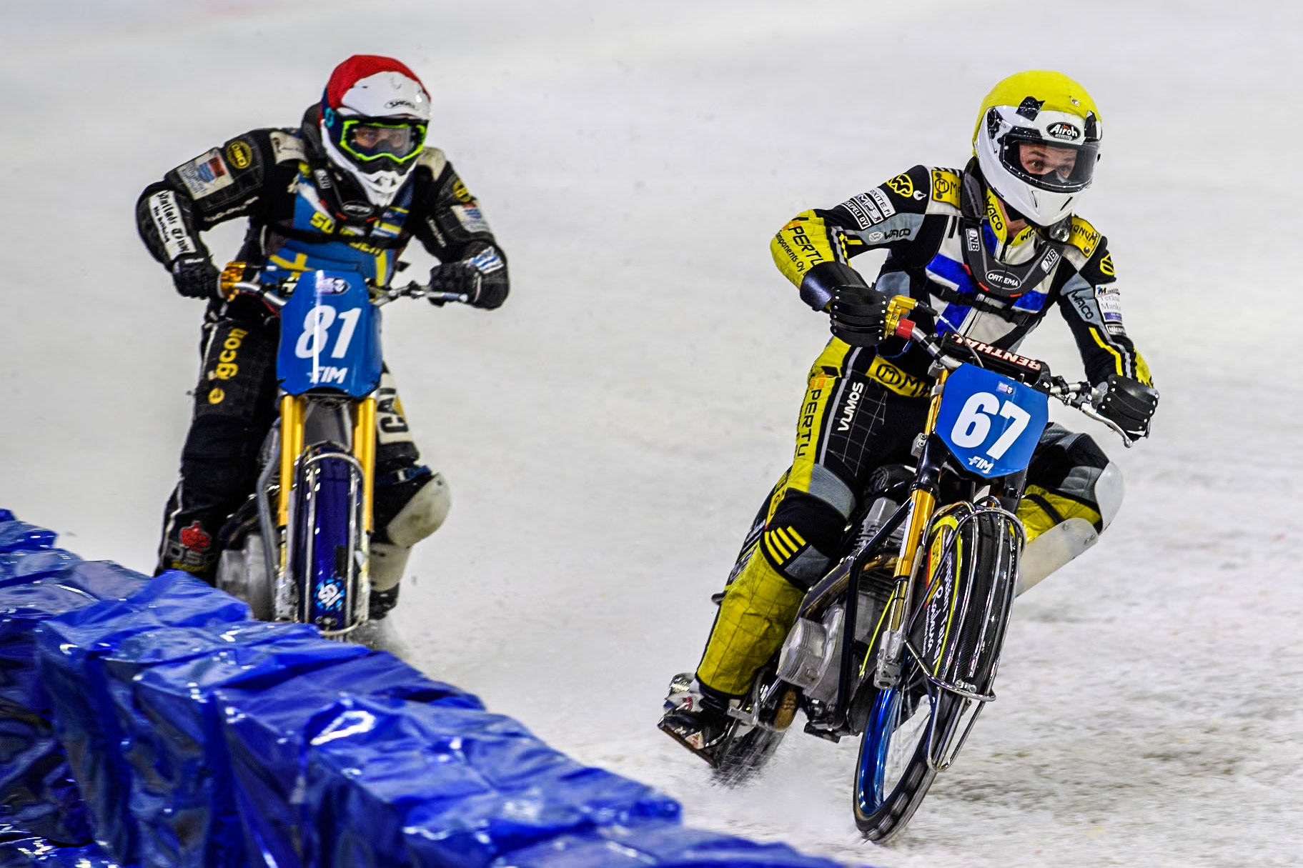 Finland's Heikki Huusko (67) in Yellow leading Sweden"s Jimmy Olsén (81) in Red during the FIM Ice Speedway Gladiators World Championship Final 4 at Ice Rink Thialf, Heerenveen on Sunday 7th April 2024. (Photo: Ian Charles | MI News)