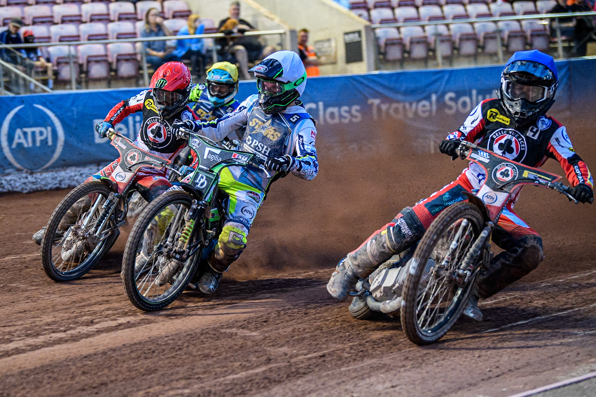 Belle Vue Aces' Ben Cook in Blue rides inside \Kings Lynn Stars' Guest Rider Charles Wright  in White, Belle Vue Aces' Jaimon Lidsey  in Red and Kings Lynn Stars' Lewis Kerr in Yellow during the Rowe Motor Oil Premiership match between Belle Vue Aces and King's Lynn Stars at the National Speedway Stadium, Manchester on Monday 12th August 2024. (Photo: Ian Charles | MI News)