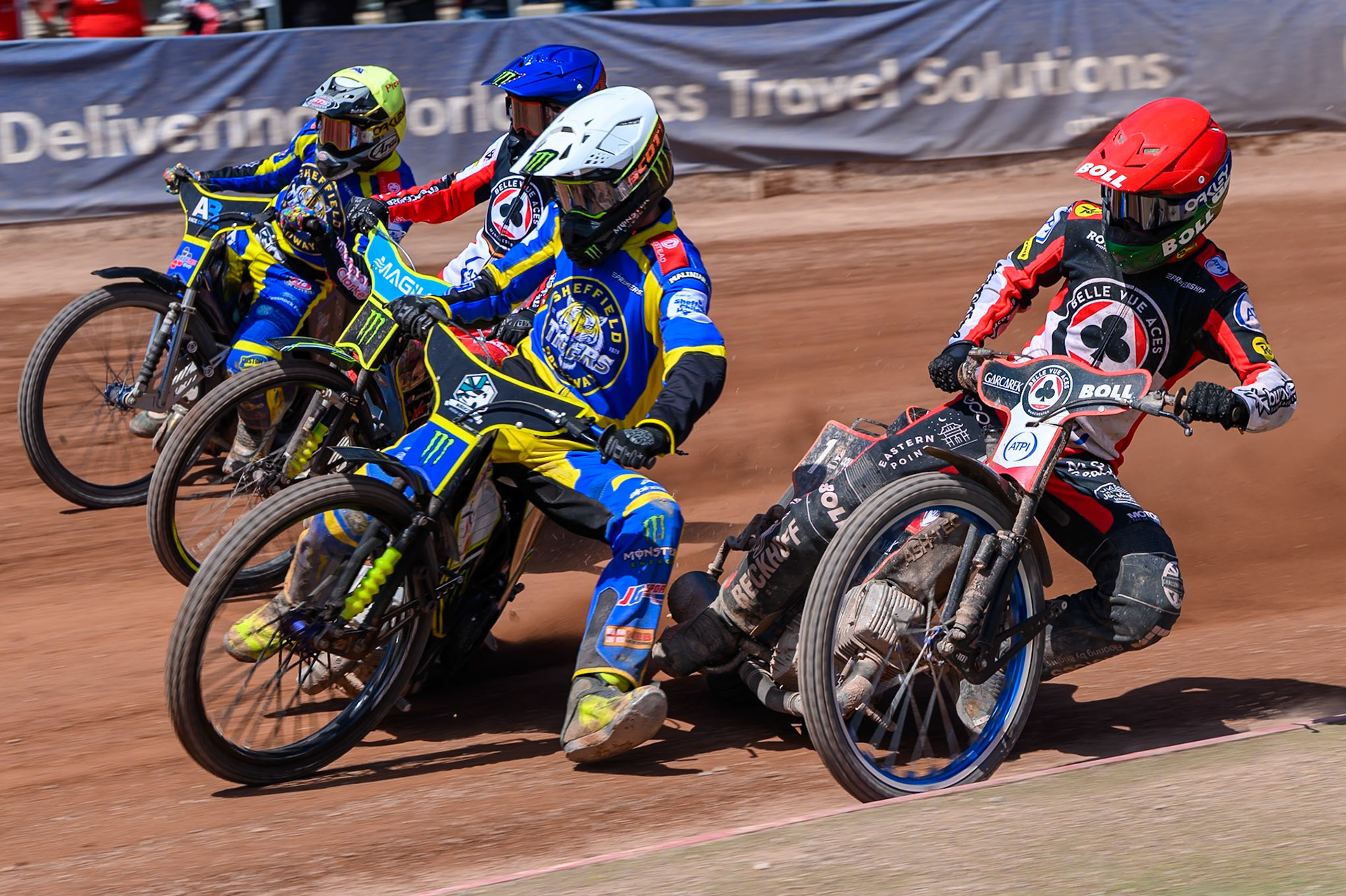 Chris Holder of Sheffield Tigers in White leading Brady Kurtz of Belle Vue Aces in Red, Josh Pickering of Sheffield Tigers in Yellow and Jaimon Lidsey, Guest Rider for Belle Vue Aces in Blue during the Rowe Motor Oil Premiership match between Belle Vue Aces and Sheffield Tigers at the National Speedway Stadium, Manchester on Monday 25th May 2026. (Photo: Ian Charles | MI News)
