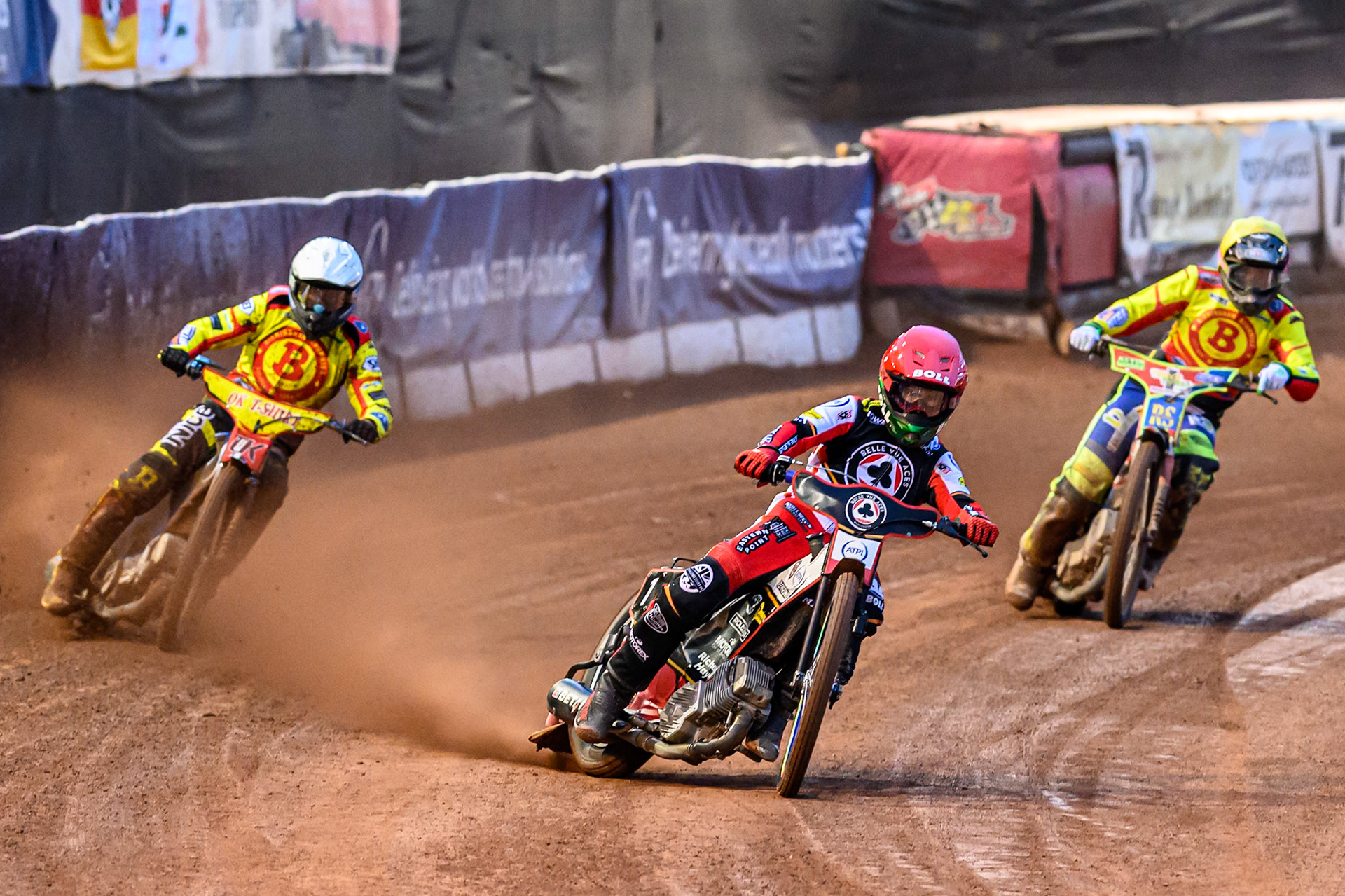 Brady Kurtz of Belle Vue Aces  in Red leading Matej Zagar of Birmingham Brummies in White and Simon Lambert, guest rider for Birmingham Brummies  in Yellow during the Rowe Motor Oil Premiership match between Belle Vue Aces and Birmingham Brummies at the National Speedway Stadium, Manchester on Monday 18th August 2025. (Photo: Ian Charles | MI News)