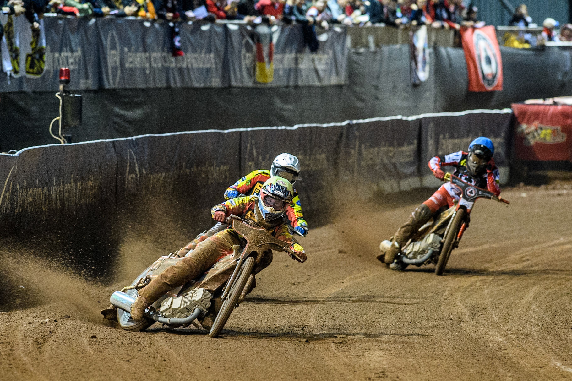 Leicester Lions' Ryan Douglas  in White leading Leicester Lions' Guest Rider Lewis Kerr  in Yellow and Belle Vue Aces' Norick Blodorn  in Blue during the Rowe Motor Oil Premiership Grand Final 1st Leg between Belle Vue Aces and Leicester Lions at the National Speedway Stadium, Manchester on Monday 23rd September 2024. (Photo: Ian Charles | MI News)