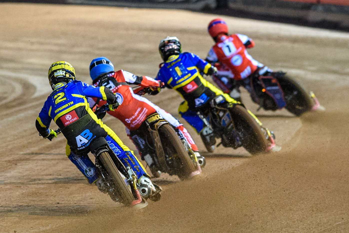 Sheffield Tigers' Kyle Howarth  in Yellow chases Belle Vue Aces' Norick Blodorn  in Blue, Sheffield Tigers' Jack Holder  in White and Belle Vue Aces' Brady Kurtz  in Red during the Rowe Motor Oil Premiership Play Off Semi Final 2, 1st Leg match between Belle Vue Aces and Sheffield Tigers at the National Speedway Stadium, Manchester on Monday 16th September 2024. (Photo: Ian Charles | MI News)