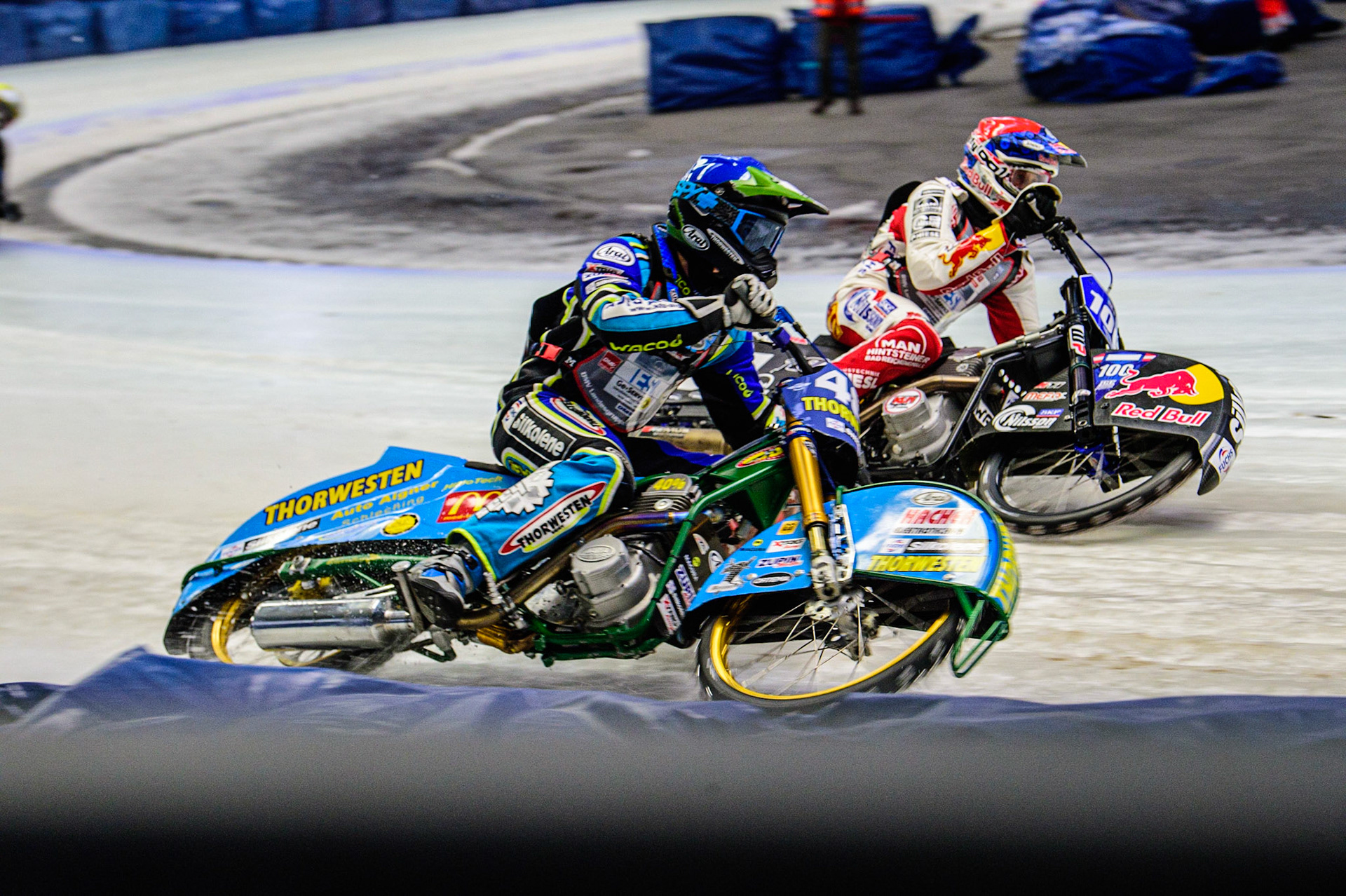 Luca Bauer (48) (Blue) outside Franz Zorn (100) (Red)  during the Ice Speedway Gladiators World Championship Final 2 at Max-Aicher-Arena, Inzell, Germany on Sunday 19th March 2023. (Photo: Ian Charles | MI News)