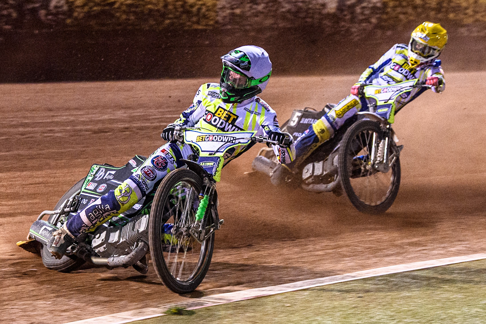 Oxford Spires' Charles Wright in White leading team mate Maciej Janowski in Yellow during the Rowe Motor Oil Premiership match between Belle Vue Aces and Oxford Spires at the National Speedway Stadium, Manchester on Monday 14th April 2025. (Photo: Ian Charles | MI News)