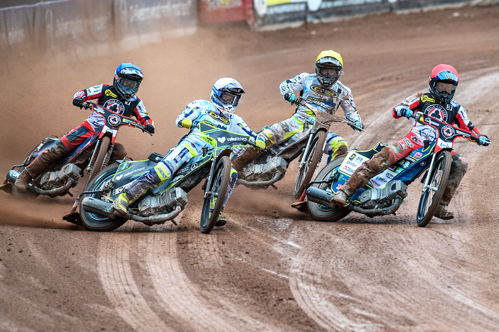 Oxford Spires' Rohan Tungate  in White rides outside Belle Vue Aces' Jaimon Lidsey  in Red with Oxford Spires' Erik Riss  in Yellow and Belle Vue Aces' Ben Cook  in Blue behind during the Rowe Motor Oil Premiership match between Belle Vue Aces and Oxford Spires at the National Speedway Stadium, Manchester on Monday 22nd July 2024. (Photo: Ian Charles | MI News)