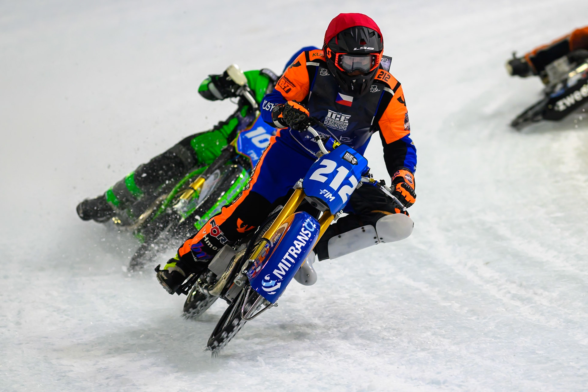 Lukas Hutla (212) of Czechia hits a rut in the ice in front of Andrej Divis (107) of Czechia in Blue during the FIM Ice Speedway Gladiators World Championship Final 3 at Ice Rink Thialf, Heerenveen on Saturday 11th April 2026. (Photo: Ian Charles | MI News)