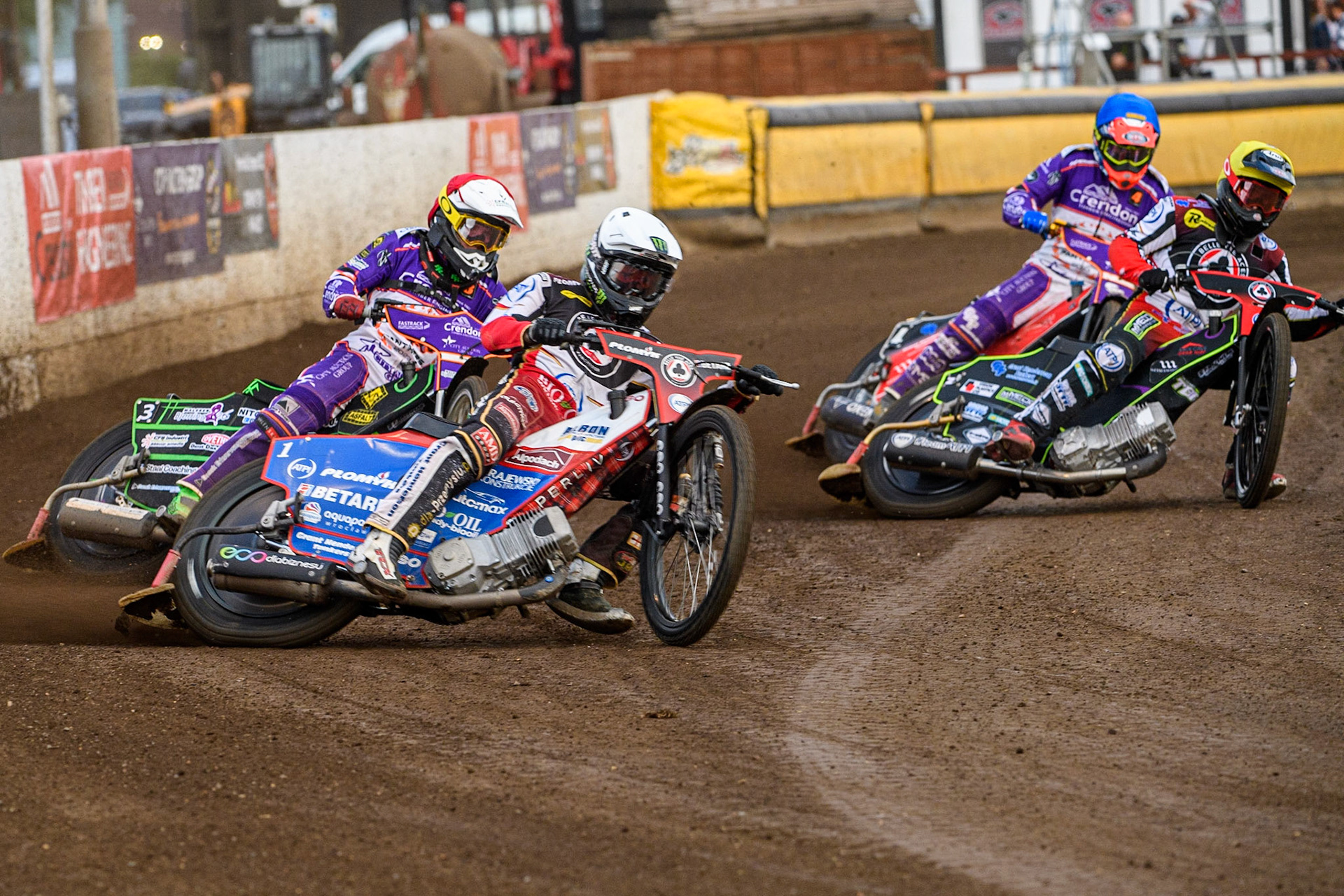 Dan Bewley (White) and Tom Brennan (Yellow) lead Benjamin Basso (Red) and Richie Worrall (Blue) during the Sports Insure Premiership match between Peterborough and Belle Vue Aces at East of England Showground, Peterborough on Monday 26th June 2023. (Photo: Ian Charles | MI News)