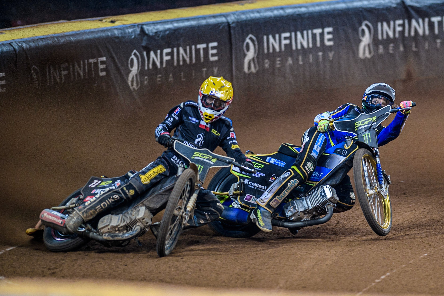 Maciej Janowski (71) (Yellow) goes wide with Jason Doyle (69) (White) behind during the FIM Speedway Grand Prix of Great Britain at the Principality Stadium, Cardiff on Saturday 2nd September 2023. (Photo: Ian Charles | MI News)