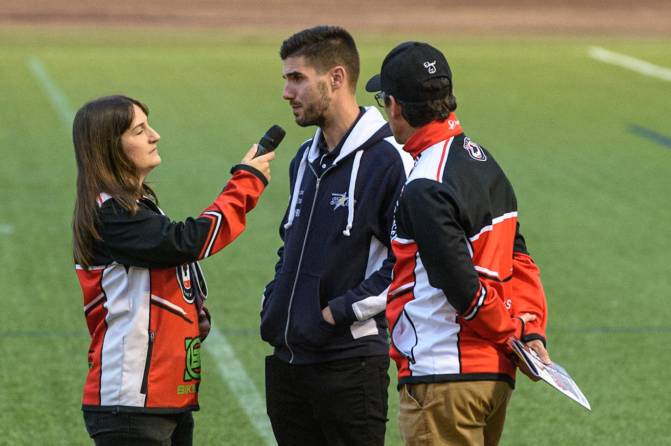 MANCHESTER, UK. SEPT 13TH  Meeting presenter Hayley Bromley interviews team managers Alex Brady  (centre) and Mark Lemon  during the SGB Premiership match between Belle Vue Aces and King's Lynn Stars at the National Speedway Stadium, Manchester on Monday 13th September 2021. (Credit: Ian Charles | MI News)