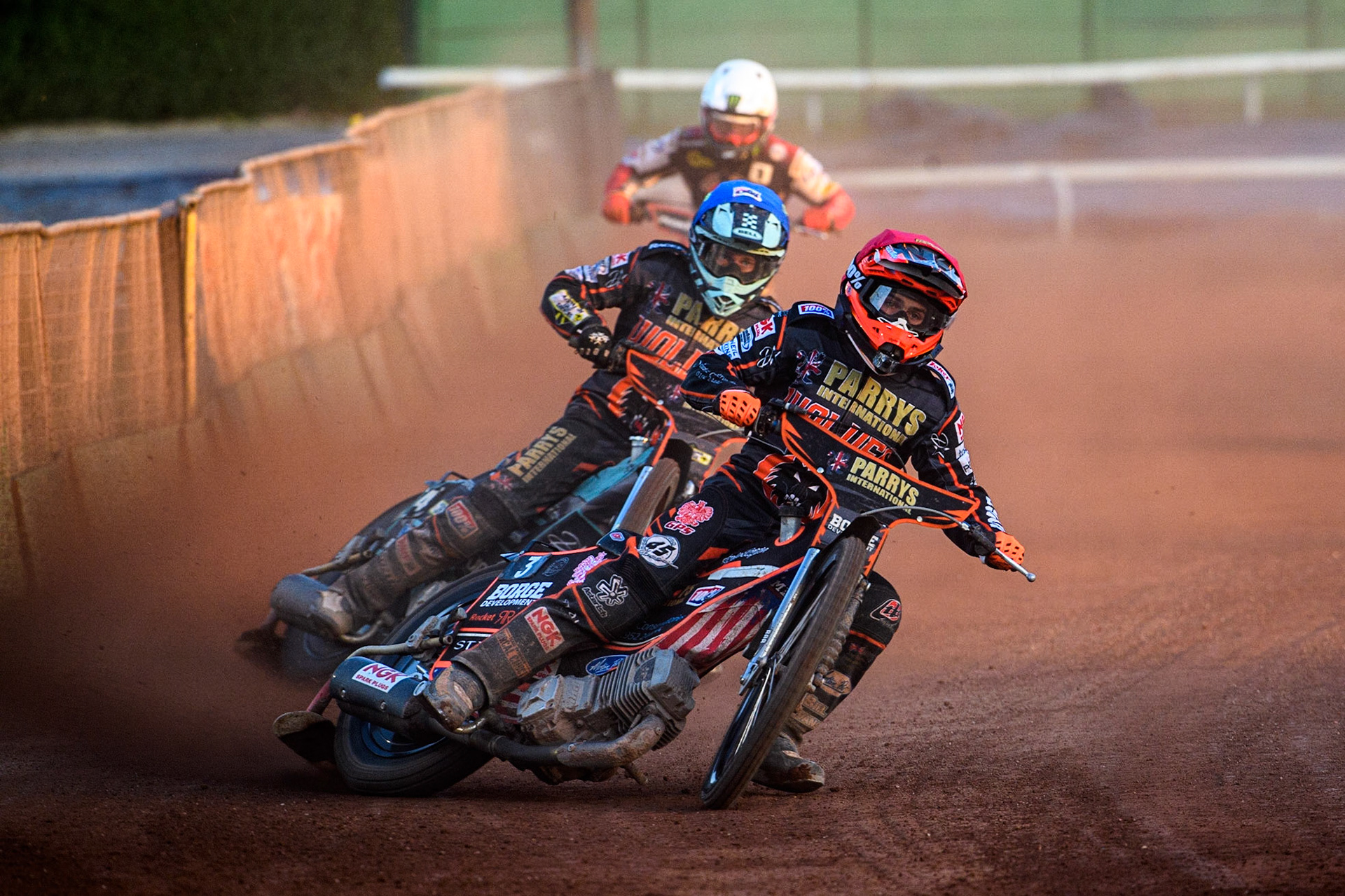 Luke Becker (Red) leads team mate Ryan Douglas (Blue) and Dan Bewley (White) during the Sports Insure Premiership match between Wolverhampton Wolves and Belle Vue Aces at Monmore Green Stadium, Wolverhampton on Monday 29th May 2023. (Photo: Ian Charles | MI News)