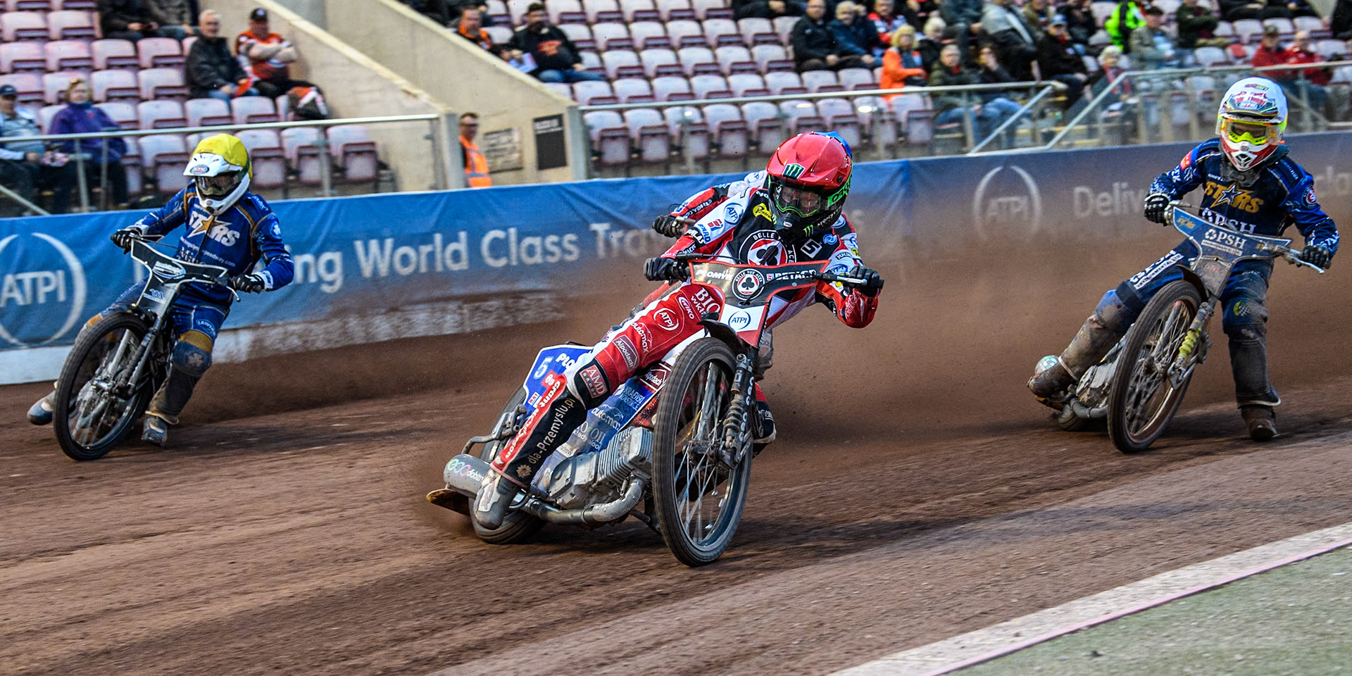 Belle Vue Aces' Dan Bewley in Red leading King Lynn Stars' Michael Palm Toft in White and King Lynn Stars' Guest Richard Lawson in Yellow with Belle Vue Aces' Connor Mountain in Blue behind during the Rowe Motor Oil Premiership match between Belle Vue Aces and King's Lynn Stars at the National Speedway Stadium, Manchester on Monday 20th May 2024. (Photo: Ian Charles | MI News)